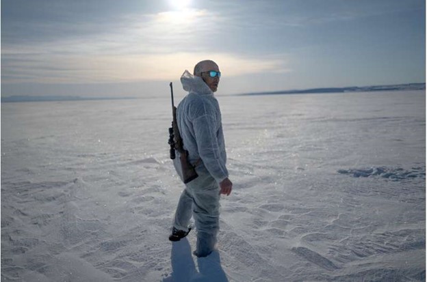 Inuit hunter Hjelmer Hammeken, 66, heads out alone onto the Greenland ice.