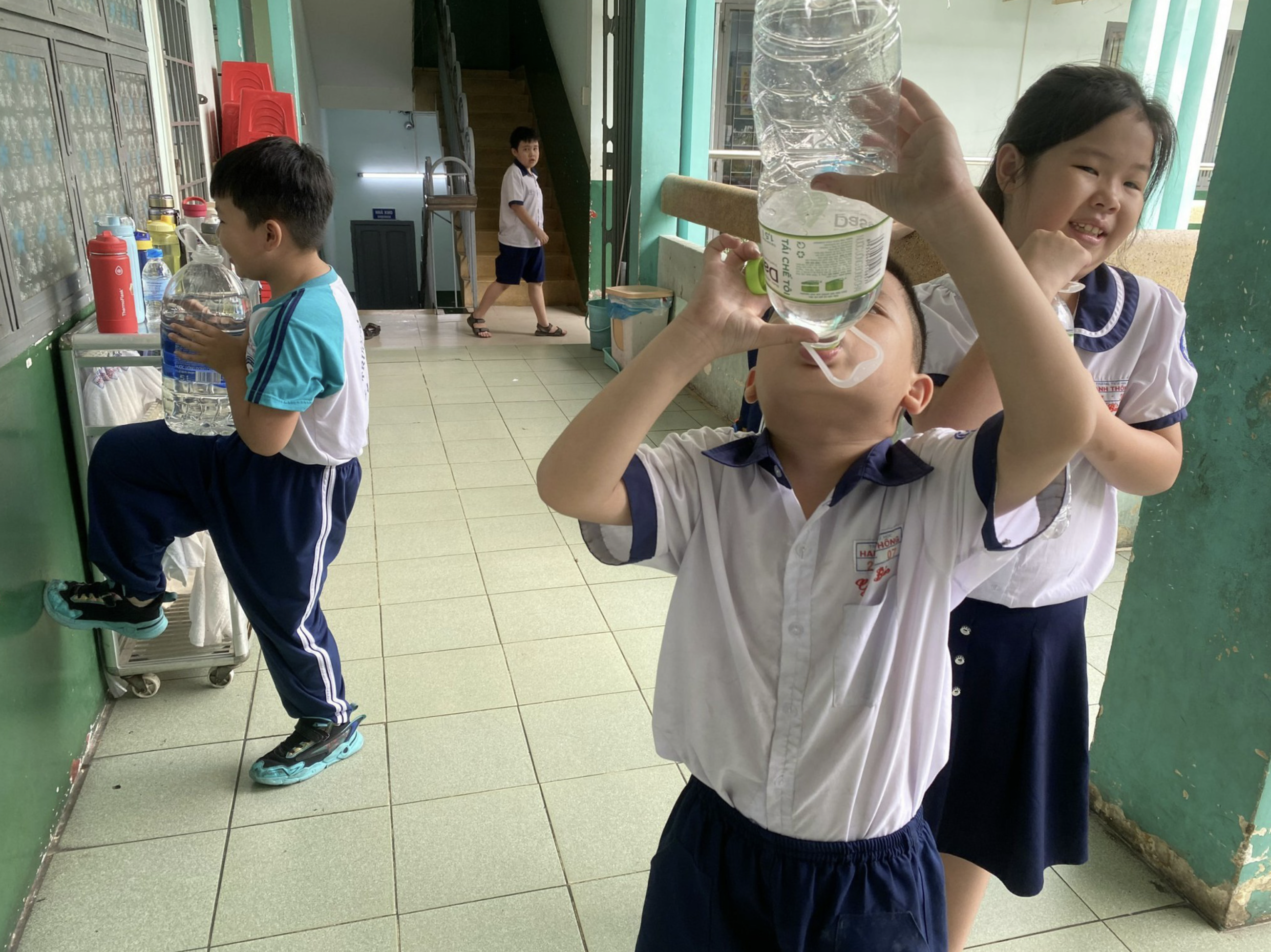 A student drinks bottled water at Hanh Thong Primary School in Go Vap District, Ho Chi Minh City. Photo: Supplied