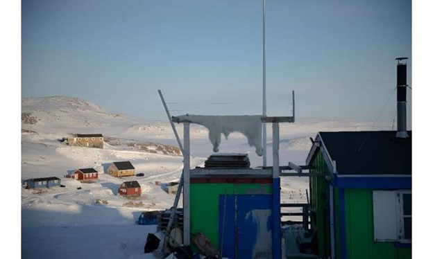 A polar bear skin dries in the freezing air of the Inuit village of Ittoqqortoormiit, Greenland.