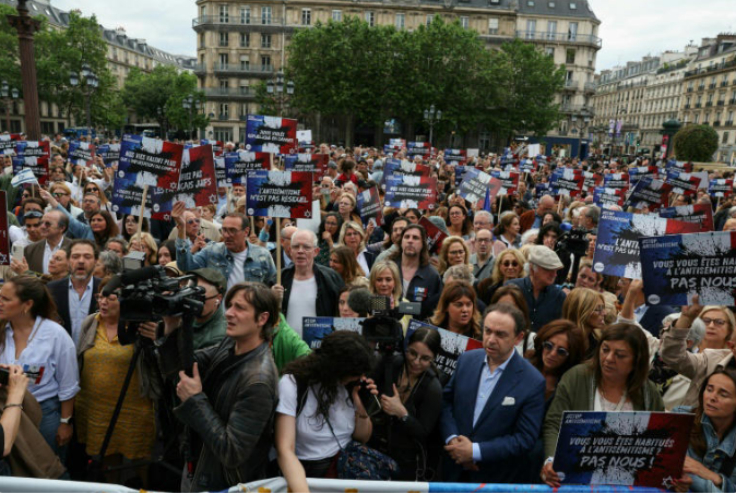 Hundreds gathered outside Paris city hall to condemn the alleged anti-Semetic gang rape of a 12 year-old girl.