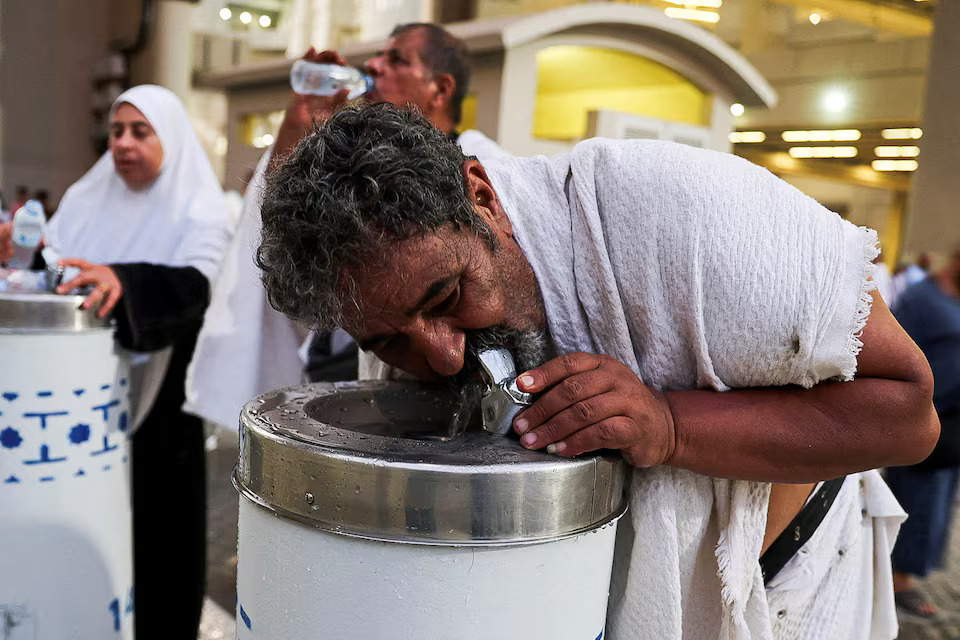 [13/42]Muslim pilgrims drink water during extremely hot weather, on the first day of the Satan stoning ritual, during the annual haj pilgrimage, in Mina, Saudi Arabia, June 16. REUTERS/Saleh Salem Purchase Licensing Rights