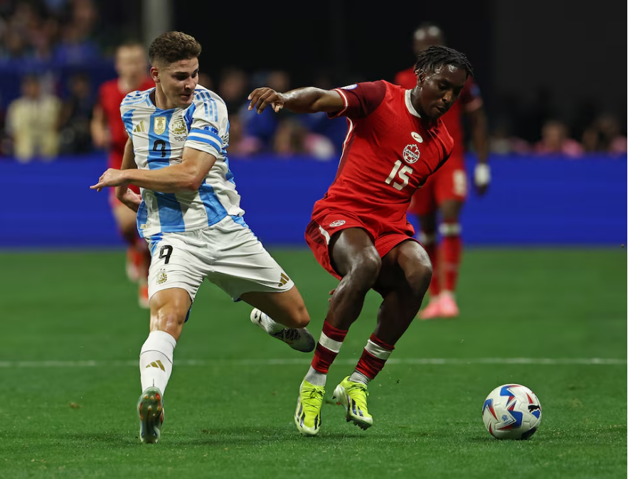 Soccer Football - Copa America 2024 - Group A - Argentina v Canada - Mercedes-Benz Stadium, Atlanta, Georgia, United States - June 20, 2024 Argentina's Julian Alvarez in action with Canada's Moise Bombito. Photo: Reuters