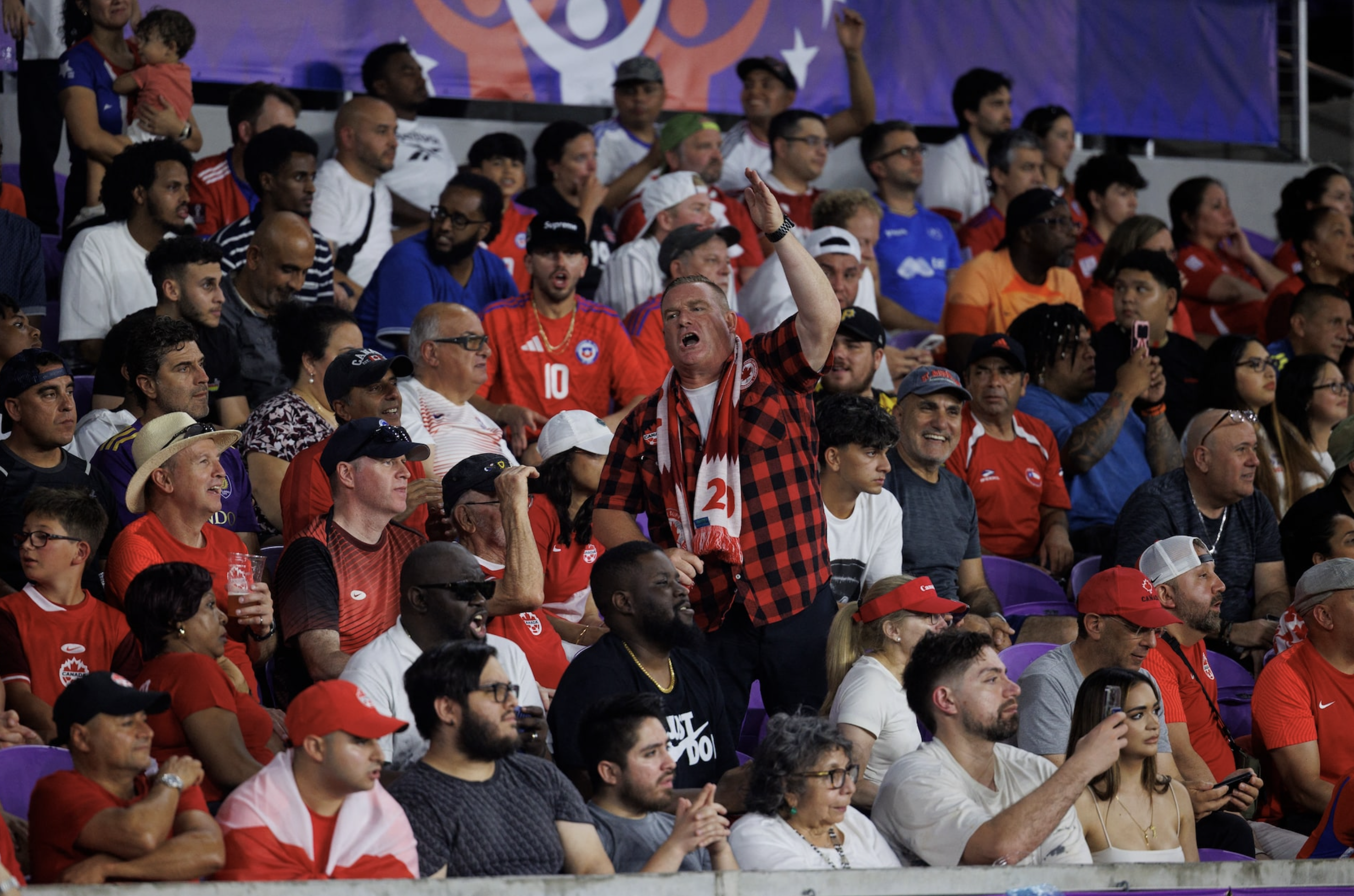 Jun 29, 2024; Orlando, FL, USA; A Canada fan cheers during the game against Chile at Inter&Co Stadium. Photo: Reuters