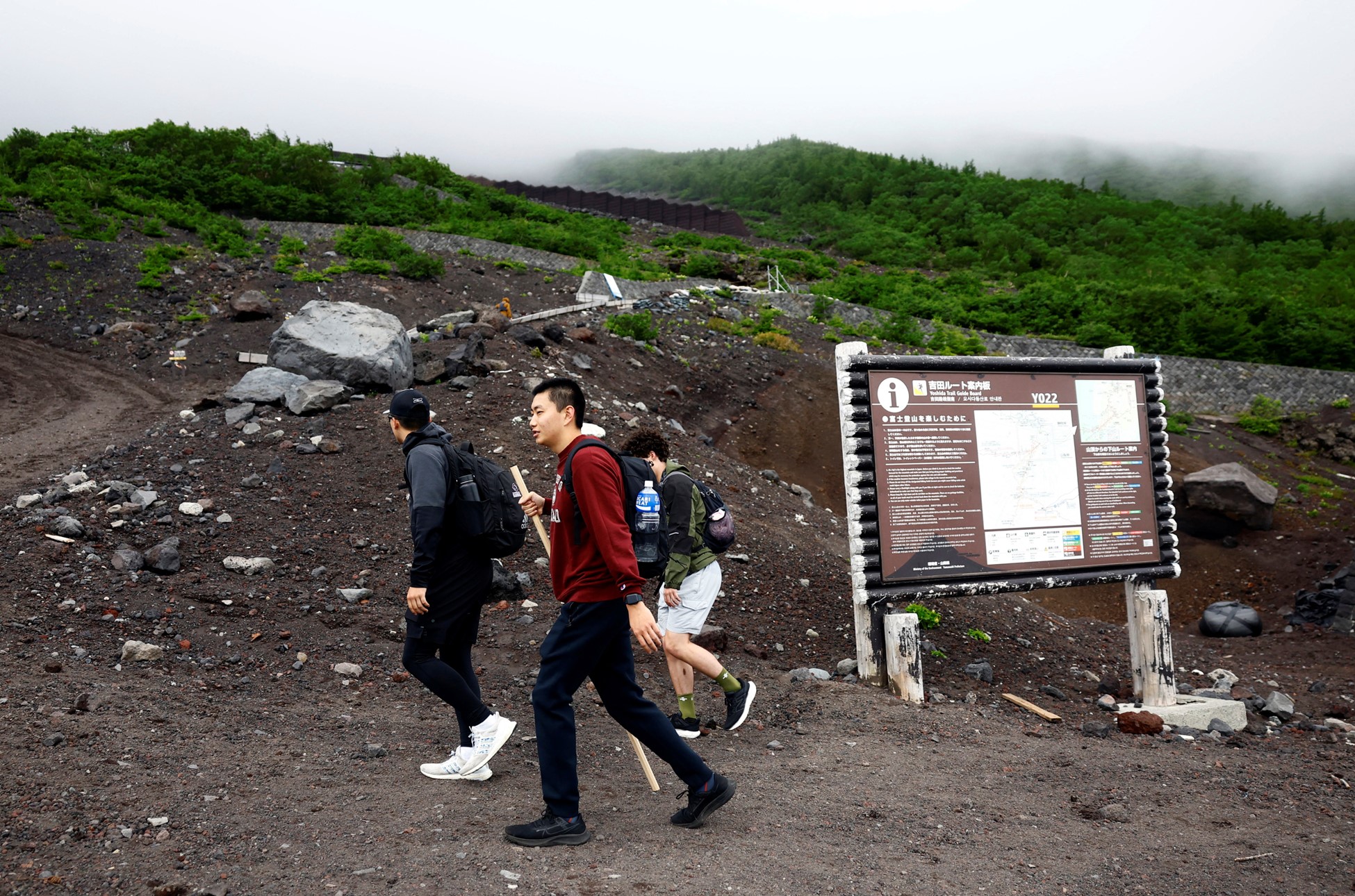 Climbers walk on Fuji Yoshidaguchi Trail (Yoshida Route) on the first day of the climbing season on the slopes of Mount Fuji, in Fujiyoshida, Yamanashi Prefecture, Japan July 1, 2024. Photo: Reuters