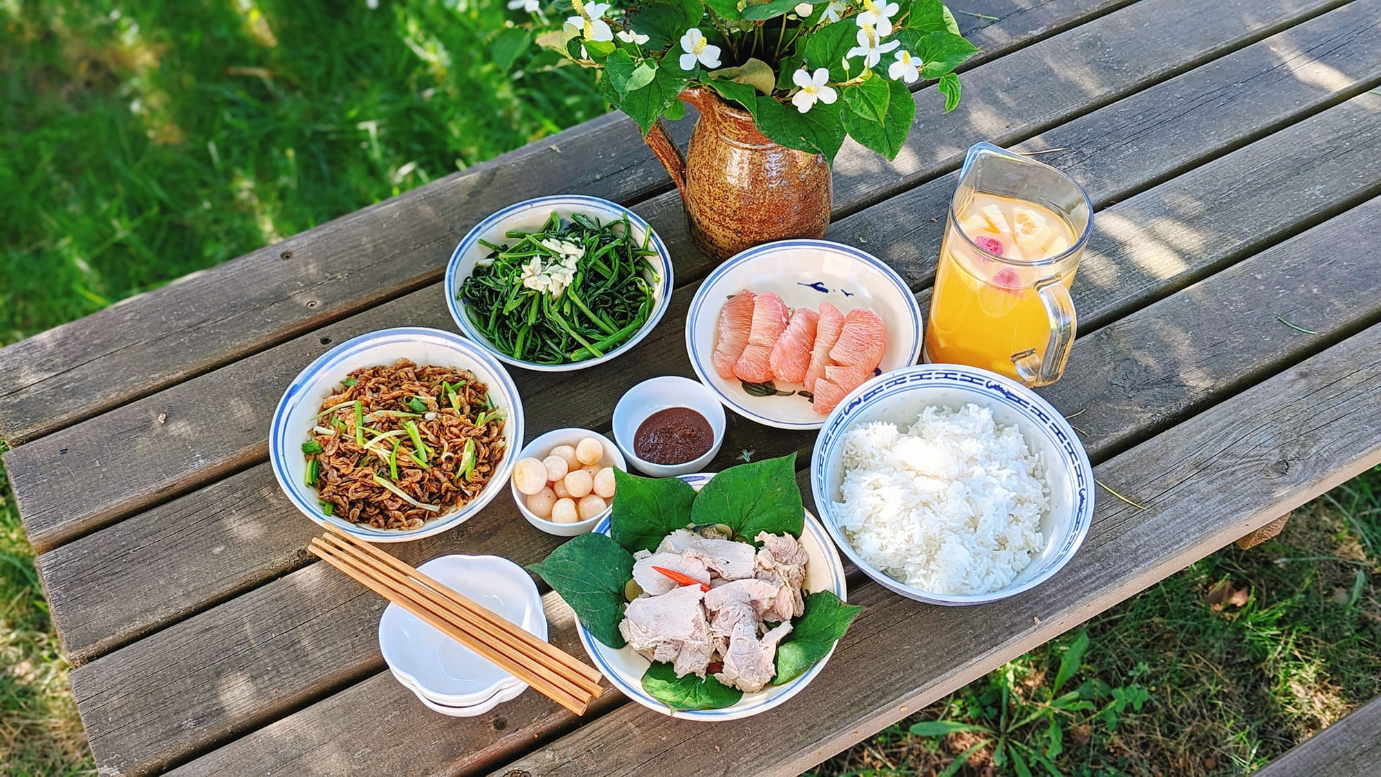 A meal containing stir-fried water spinach, roasted dried baby shrimp, boiled meat dipped with shrimp sauce, and salted eggplant prepared by Do Thuy Linh in France. Photo: Supplied