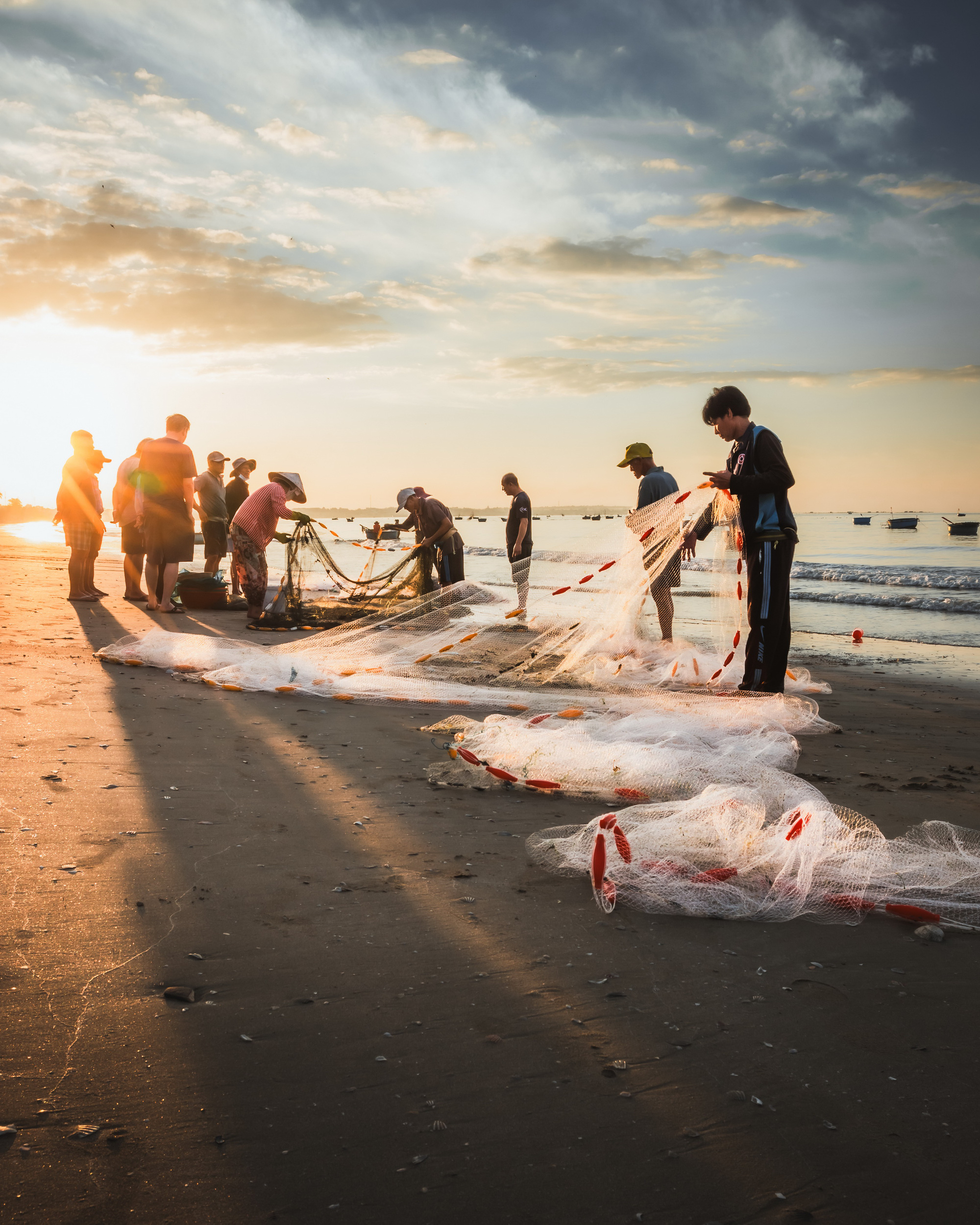 Locals sort seafood after a fishing trip in the early morning at a fishing village in Mui Ne, a coastal town in Binh Thuan Province, southern-central Vietnam. Photo taken by Harry Bradley