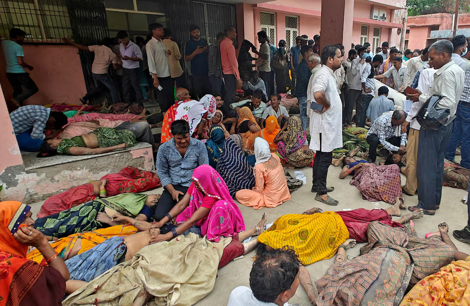 SENSITIVE MATERIAL. THIS IMAGE MAY OFFEND OR DISTURB People mourn next to the bodies of victims of a stampede outside a hospital in Hathras district in the northern state of Uttar Pradesh, India, July 2, 2024. Photo: Reuters
