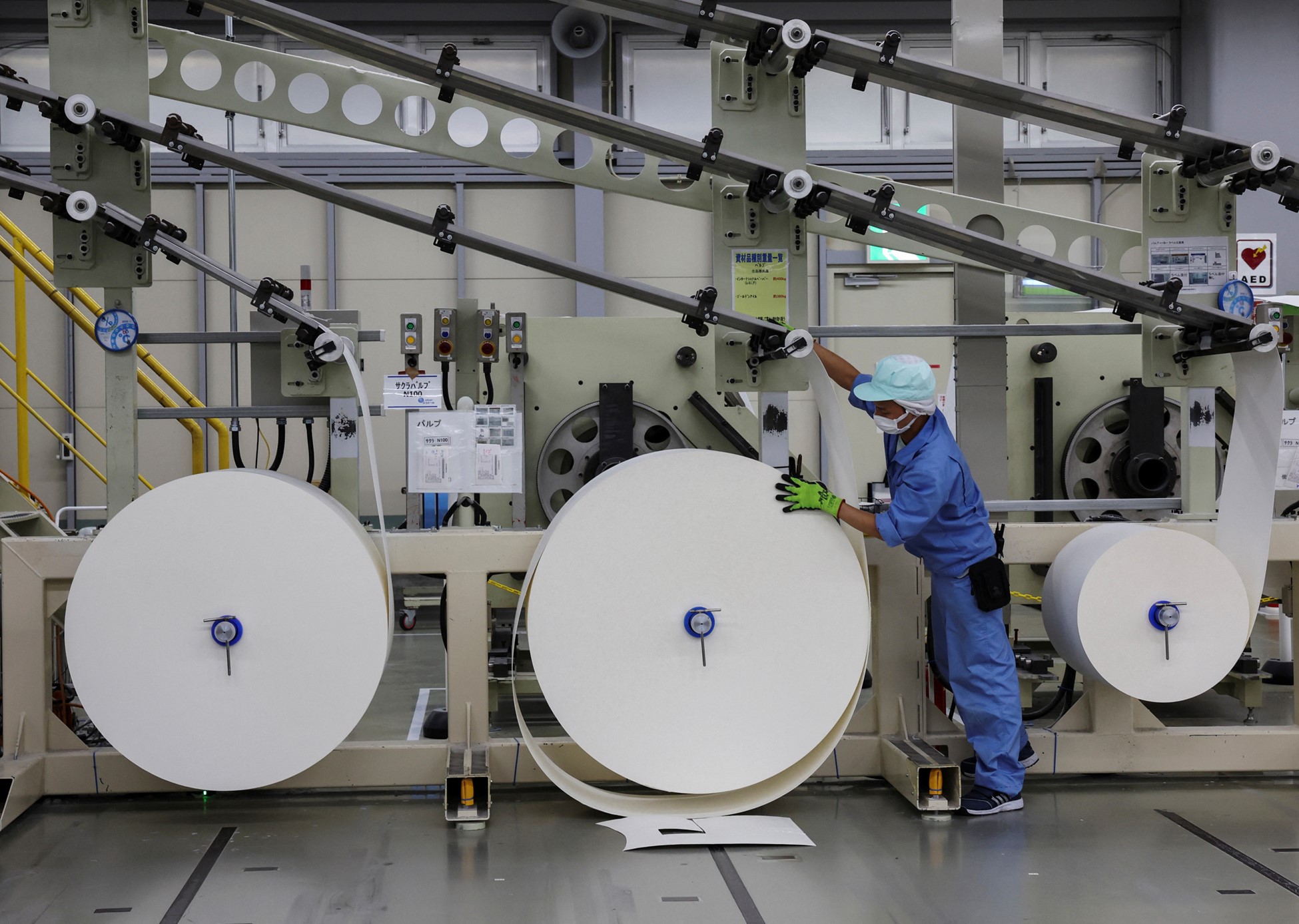 An employee works on an adult diaper production line at a factory of Daio Paper Corporation's subsidiary Elleair in Fujinomiya, Shizuoka prefecture, Japan June 18, 2024. Photo: Reuters