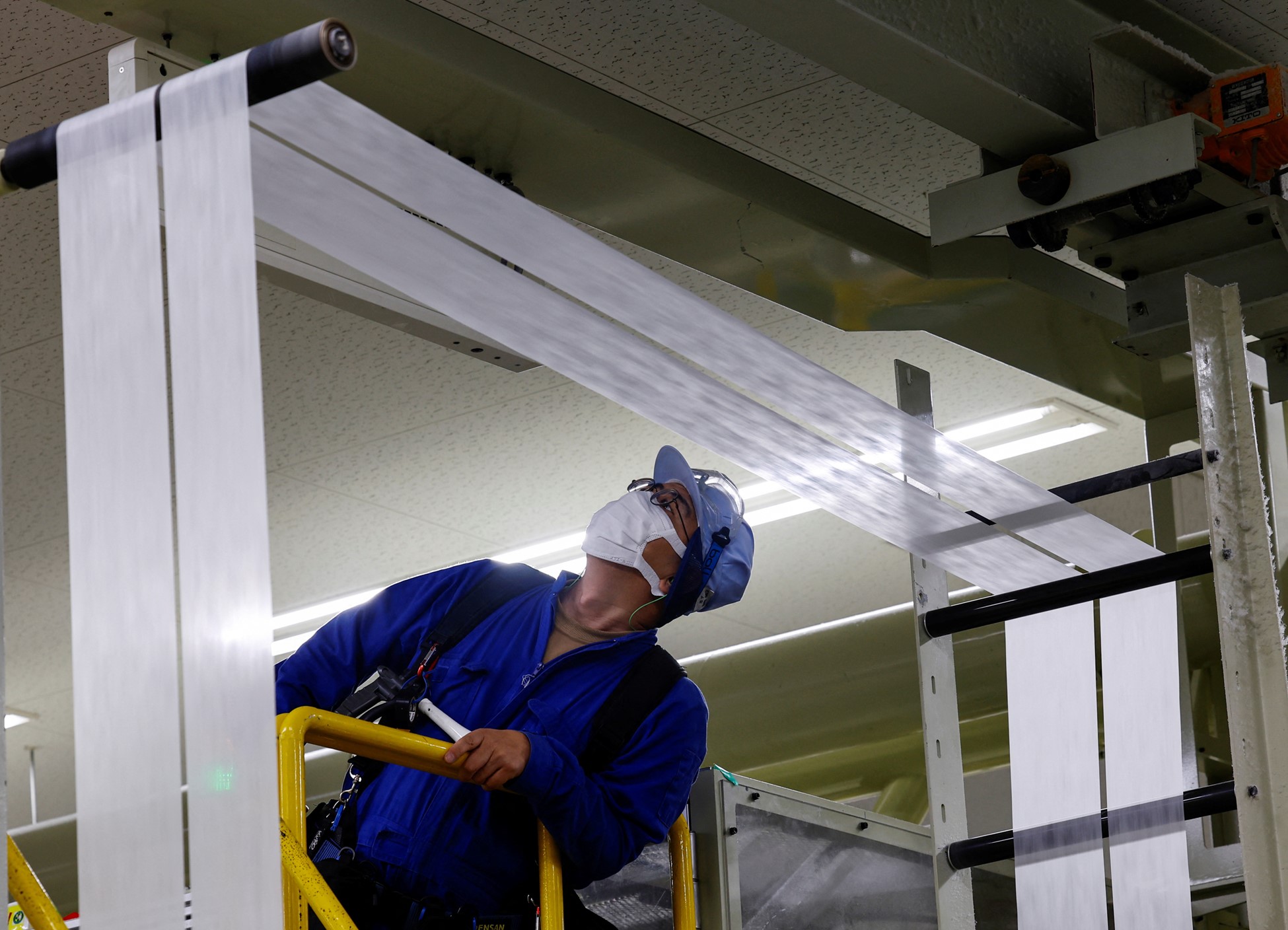 An employee works on an adult diaper production line at a factory of Daio Paper Corporation's subsidiary Elleair in Fujinomiya, Shizuoka prefecture, Japan June 18, 2024. Photo: Reuters