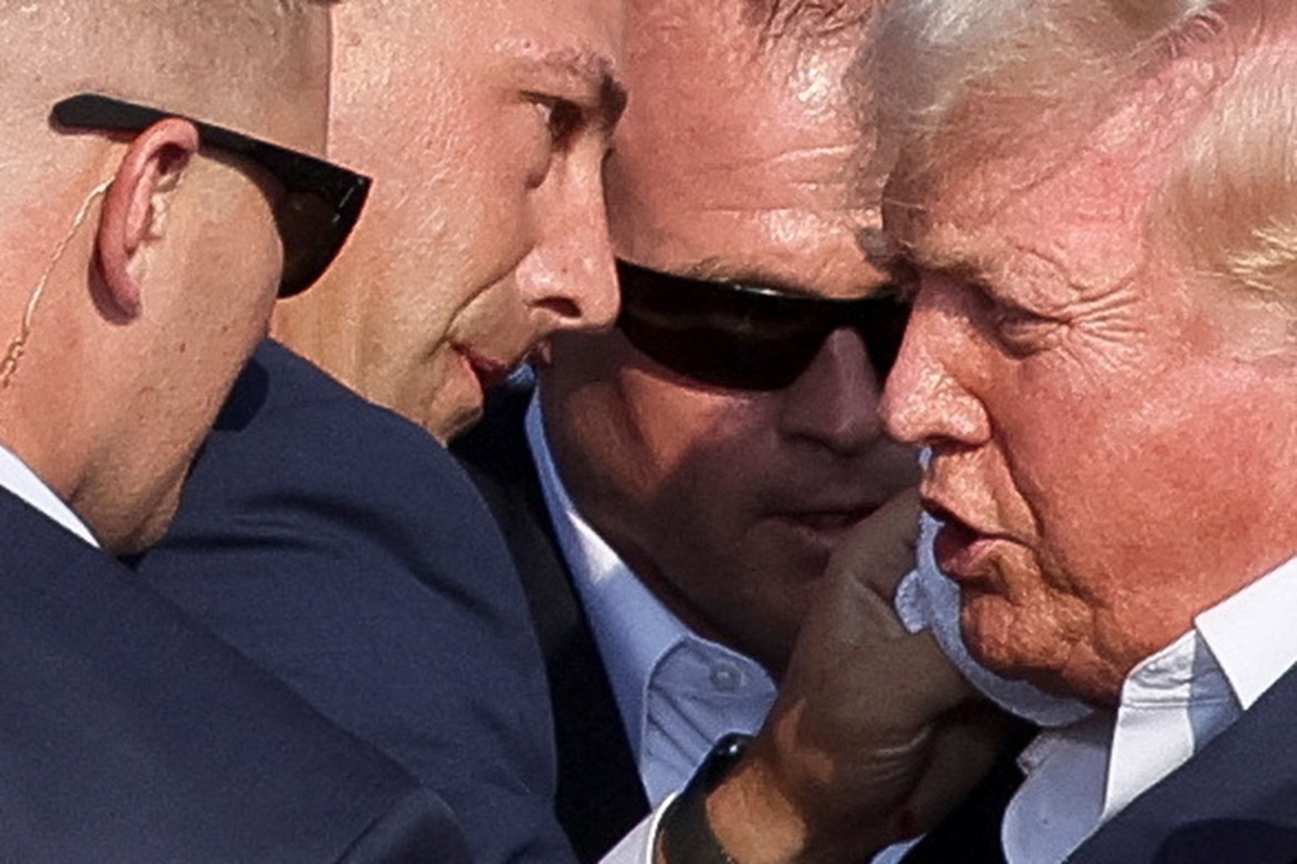 ecret Service assists Republican presidential candidate and former President Donald Trump during a campaign rally at the Butler Farm Show in Butler, Pennsylvania, July 13. Photo: Reuters