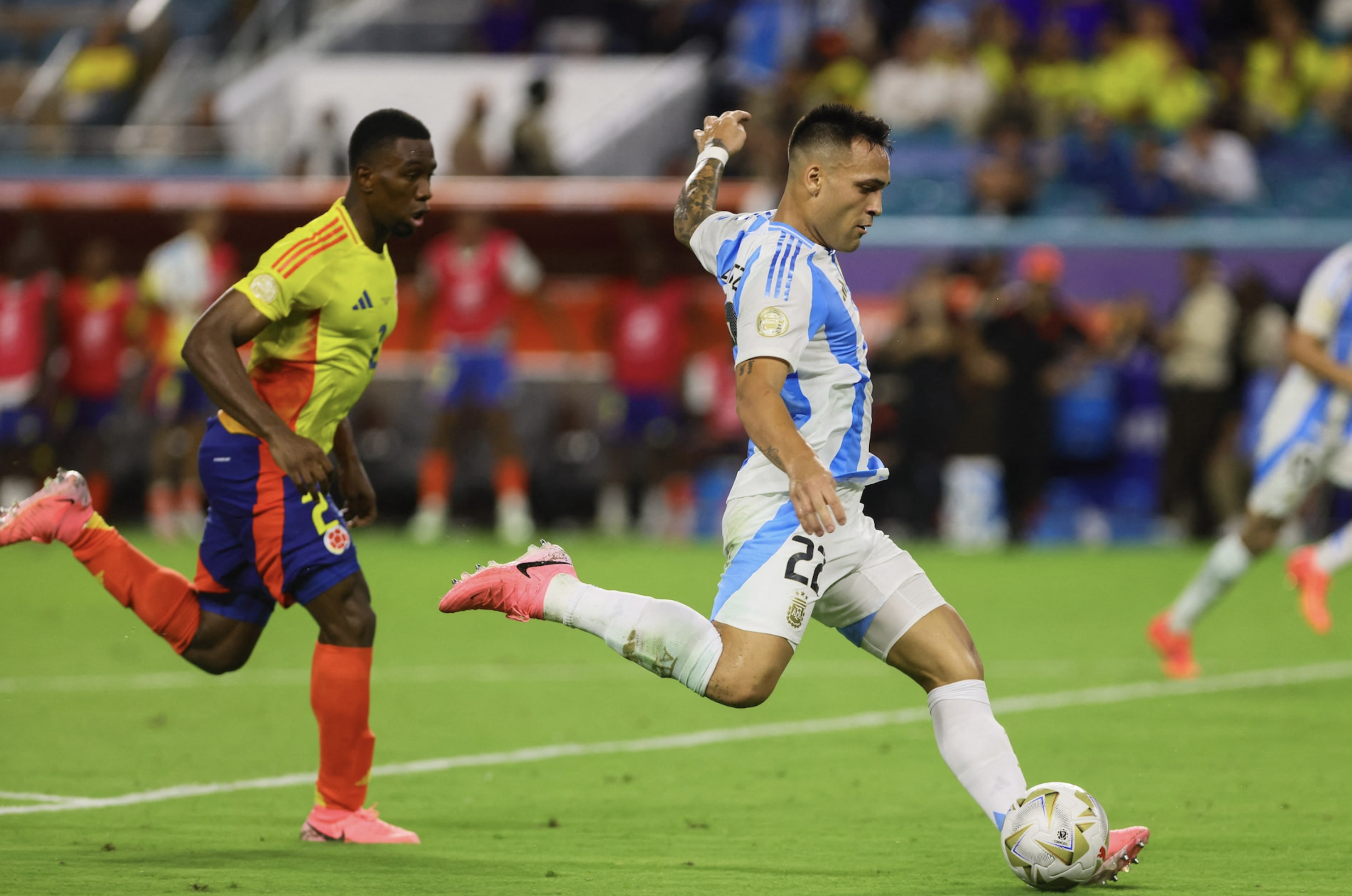 Jul 14, 2024; Miami, FL, USA; Argentina forward Lautaro Martinez (22) shoots and scores against Colombia against Colombia during the second half of extra time of the Copa America final at Hard Rock Stadium. Photo: Reuters