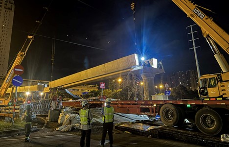 Workers at the construction site of a footbridge connecting the first metro line in Ho Chi Minh City. Photo: MAUR