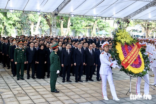 The CPV Central Committee delegation, led by State President To Lam, pays tribute to Party General Secretary Nguyen Phu Trong at the National Funeral Hall in Hanoi on July 25, 2024. Photo: Nguyen Khanh / Tuoi Tre