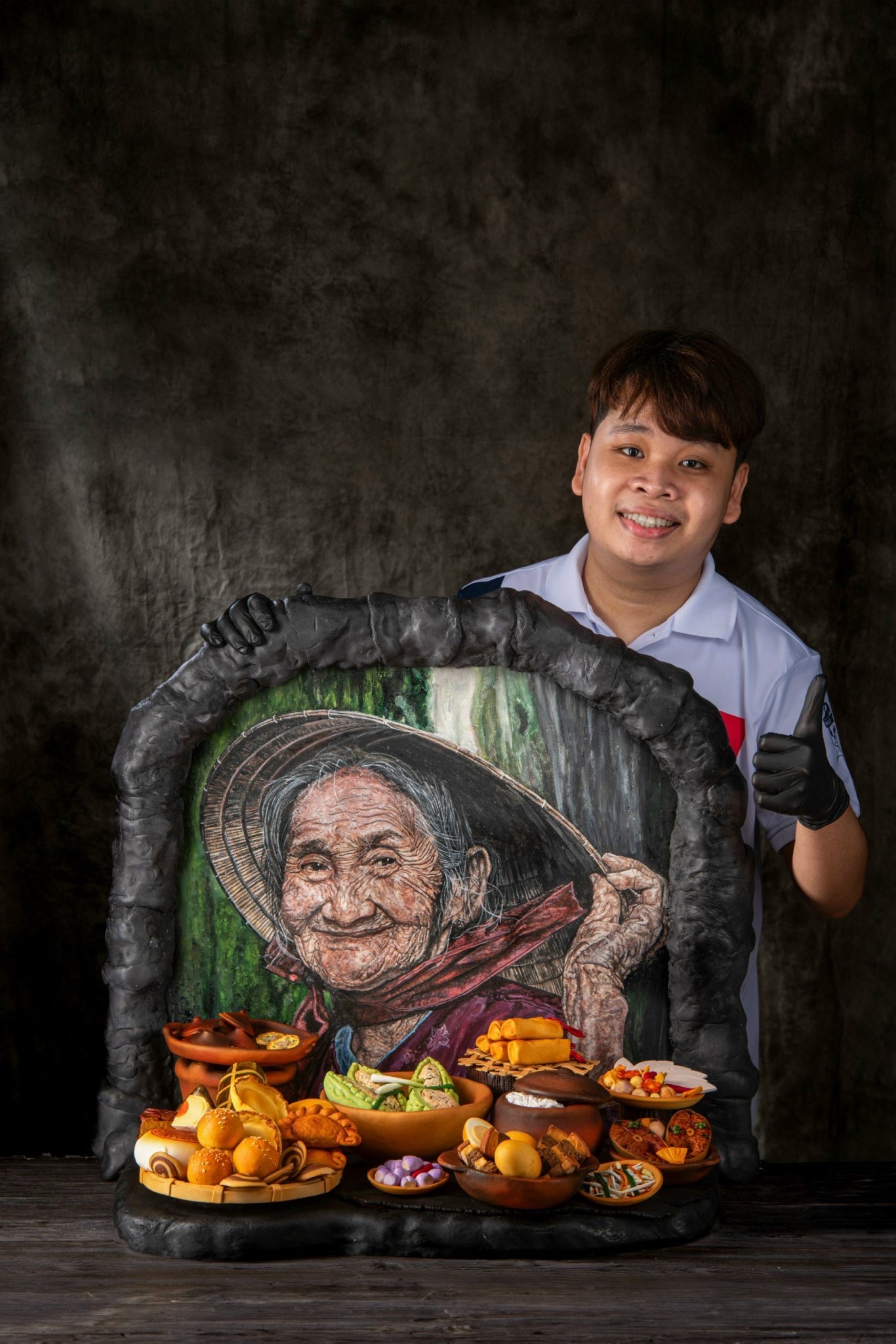 Nguyen Huu Thien An poses with his ‘Memories’ fondant art which won a silver medal at the Pastry Art Showpiece category at the 2024 Battle of the Chefs in Penang, Malaysia in June 2024. Photo: Supplied