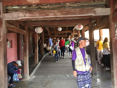 Tourists walk through the pagoda before it is restored.