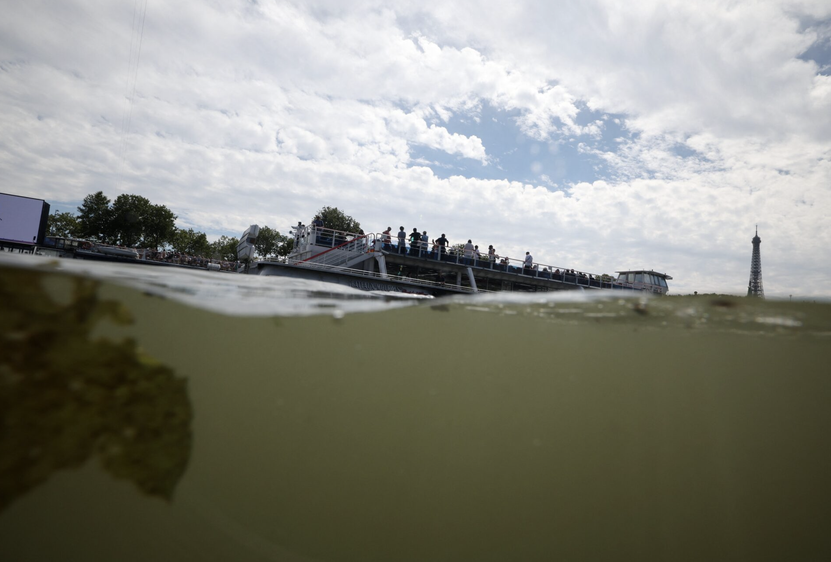 Paris 2024 Olympics - Triathlon - Alexander III Bridge, Paris, France - July 28, 2024. General view of the Eiffel Tower and the River Seine taken from the Triathlon start after training was cancelled amid water quality concerns. Photo: Reuters