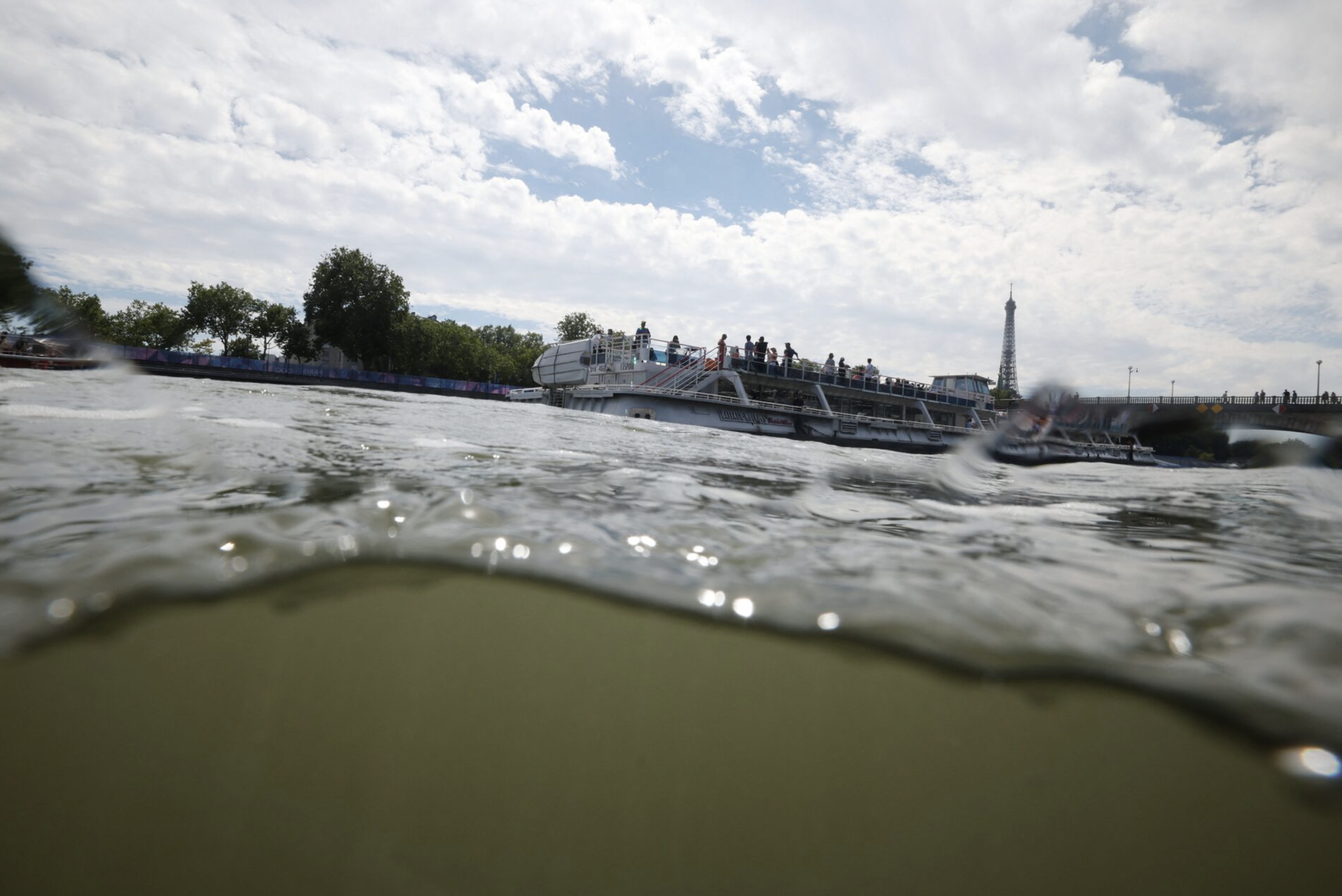 Paris 2024 Olympics - Triathlon - Alexander III Bridge, Paris, France - July 28, 2024. General view of the Eiffel Tower and the River Seine taken from the Triathlon start after training was cancelled amid water quality concerns. Photo: Reuters