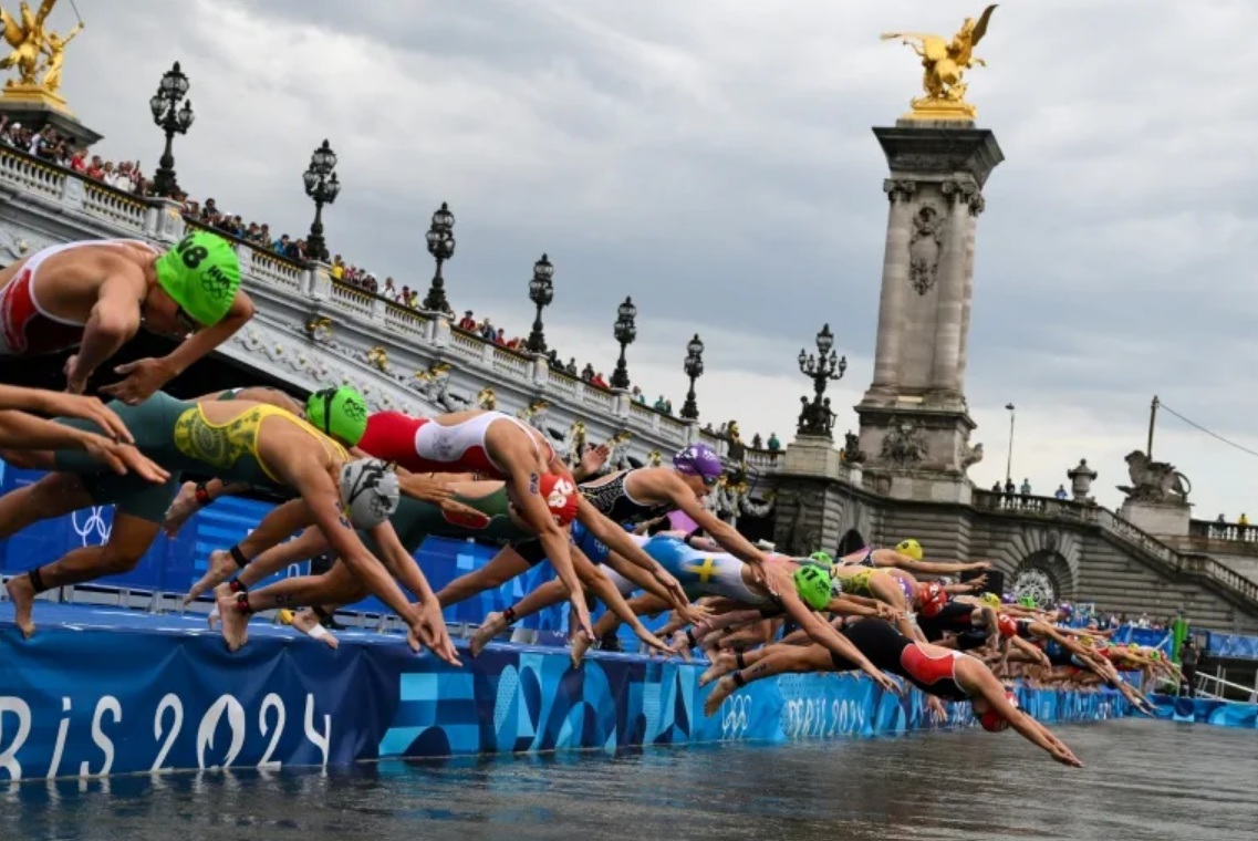 Women triathletes dive into River Seine at Paris Olympics