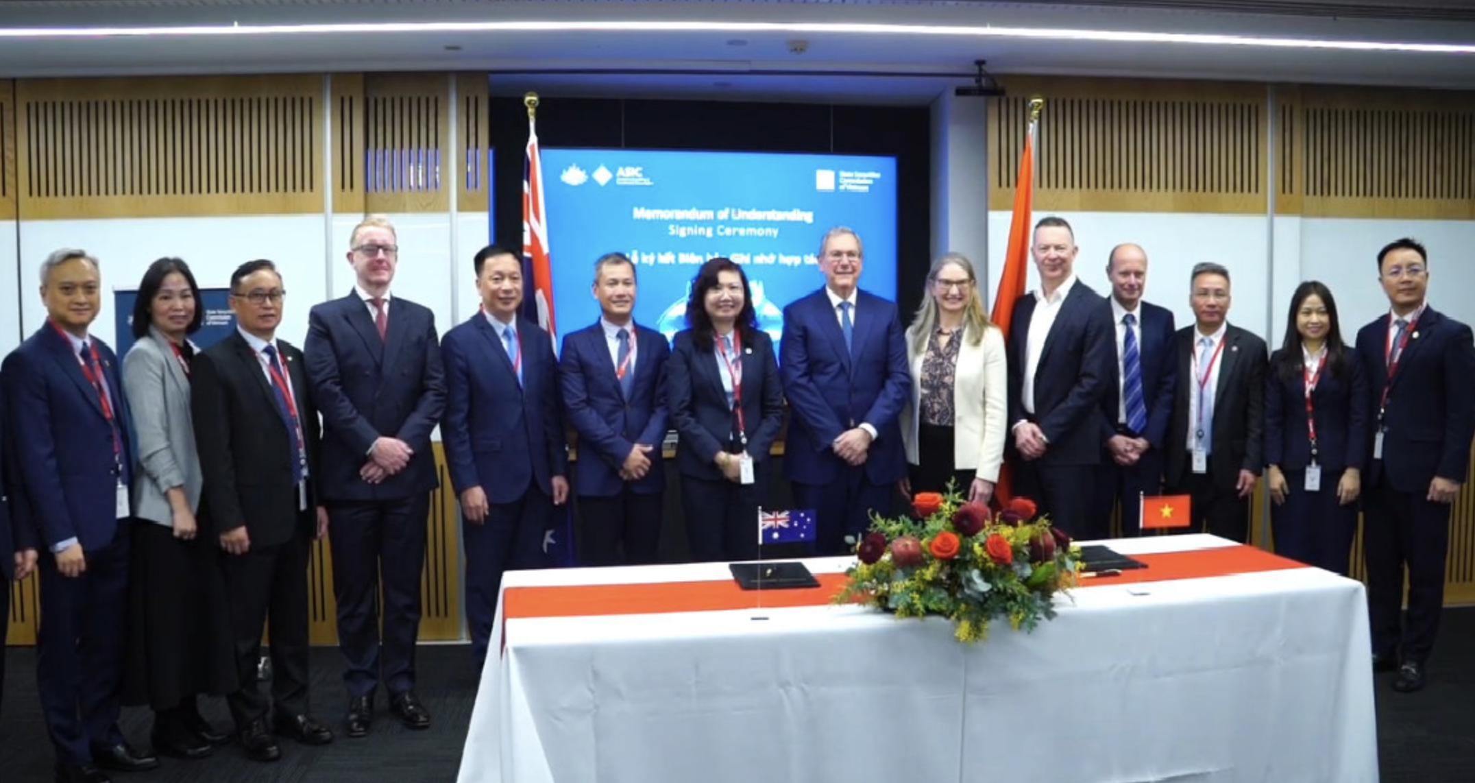 Representatives of the State Securities Commission of Vietnam (SSC) and the Australian Securities and Investments Commission (ASIC) pose for a photo at a signing ceremony of a memorandum of understanding in Sydney on August 2, 2024.