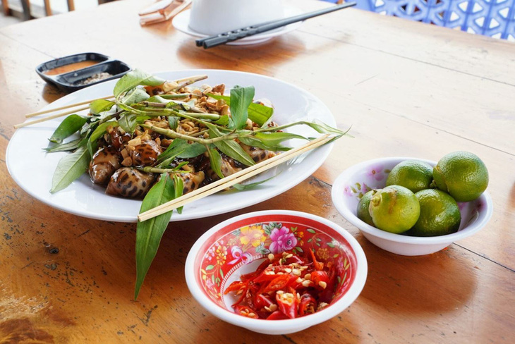 Stir-fried spotted babylon snails. Photo: Taste Atlas