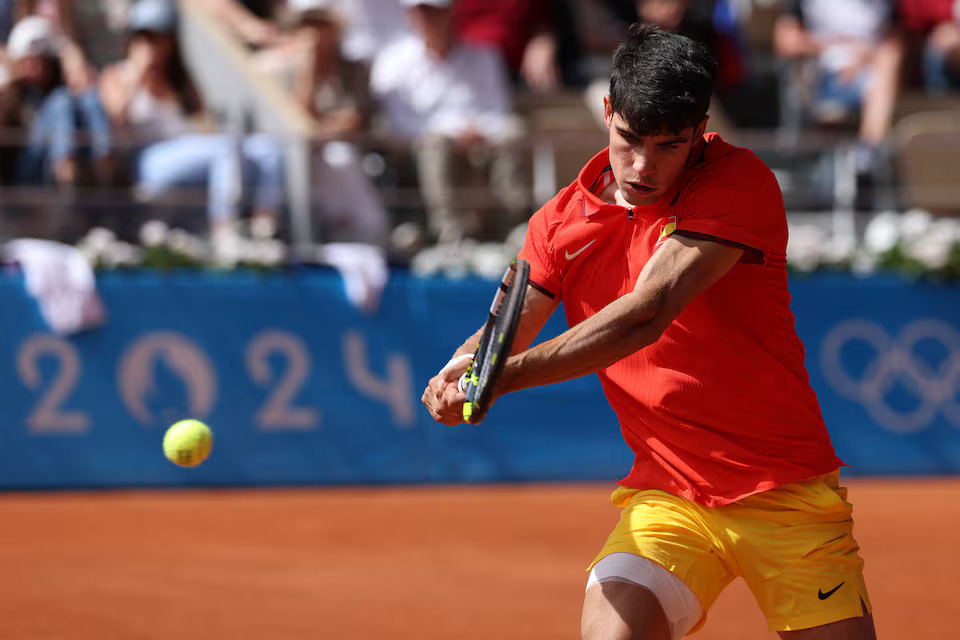 Paris 2024 Olympics - Tennis - Men's Singles Gold Medal Match - Roland-Garros Stadium, Paris, France - August 04, 2024. Carlos Alcaraz of Spain in action during his match against Novak Djokovic of Serbia. Photo: Reuters