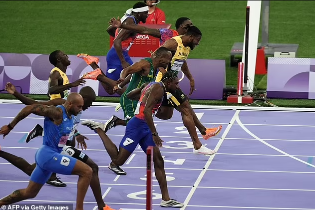 America’s Noah Lyles wins Olympic gold in 100m sprint by five-thousandths of a second