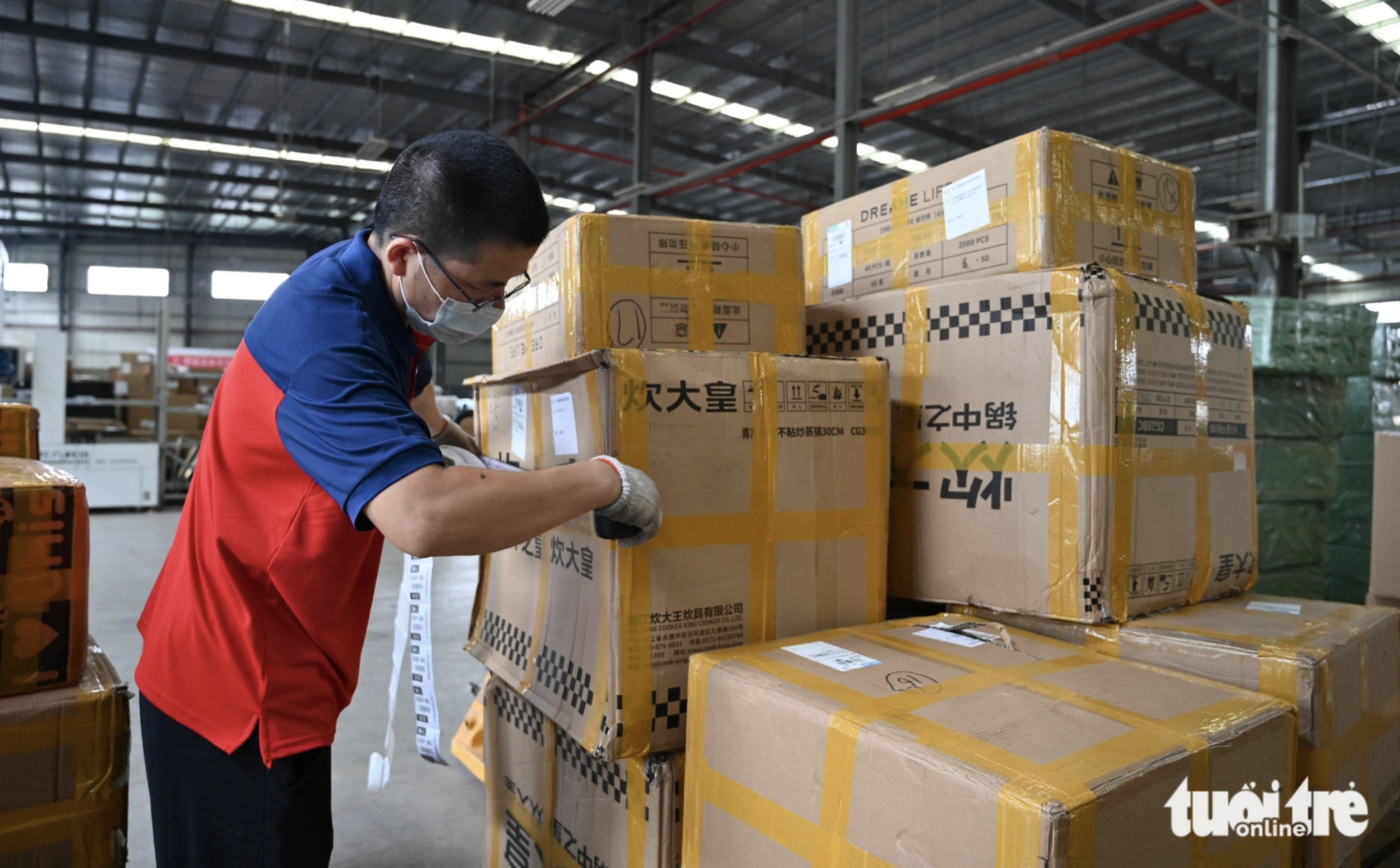 Packages are stored at a warehouse in China before being transported to Da Nang, Vietnam.