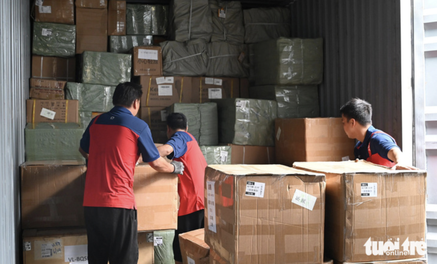 Goods loaded onto a container truck at a warehouse in Dongguan before being transported to Vietnam.