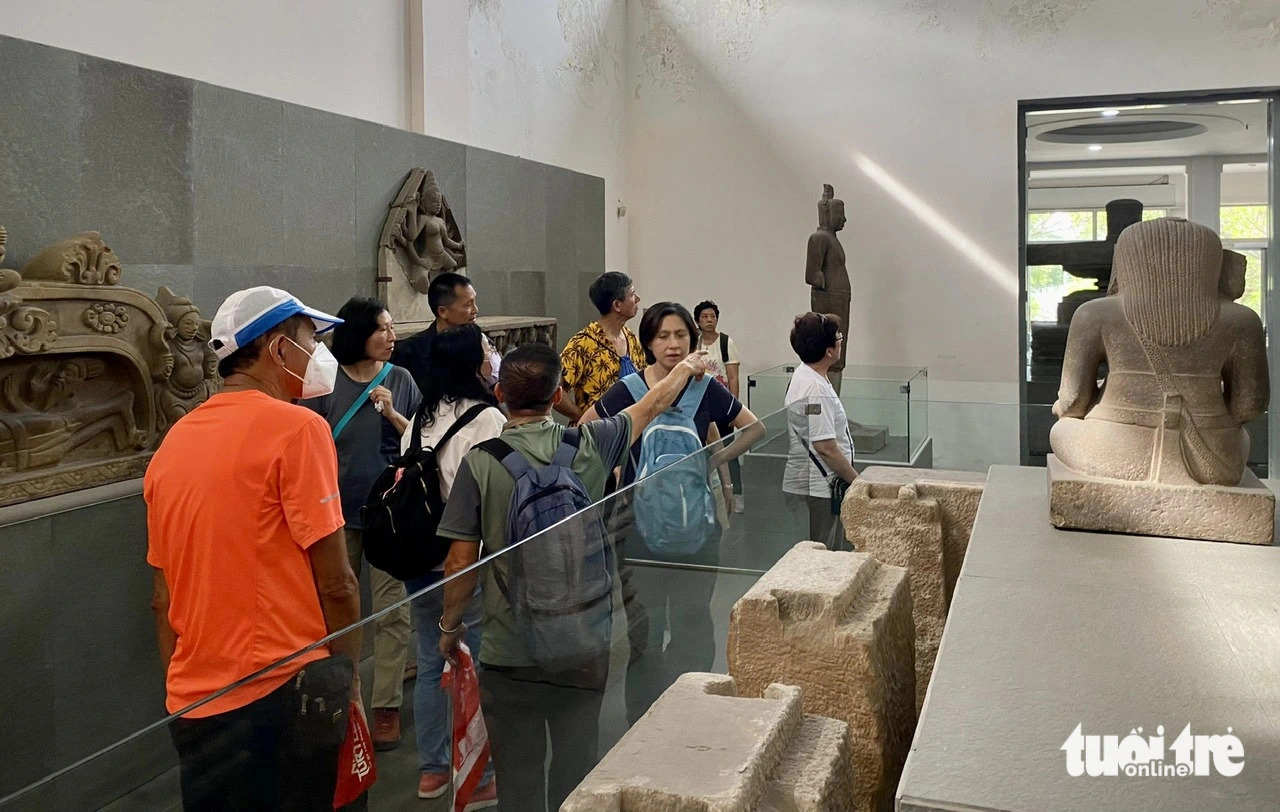 Visitors explore the Cham Sculpture Museum in Da Nang City, central Vietnam. Photo: Truong Trung / Tuoi Tre