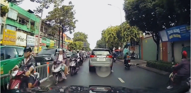 Motorbike riders on the wrong side of the road on Phan Van Tri Street in Go Vap District, Ho Chi Minh City.