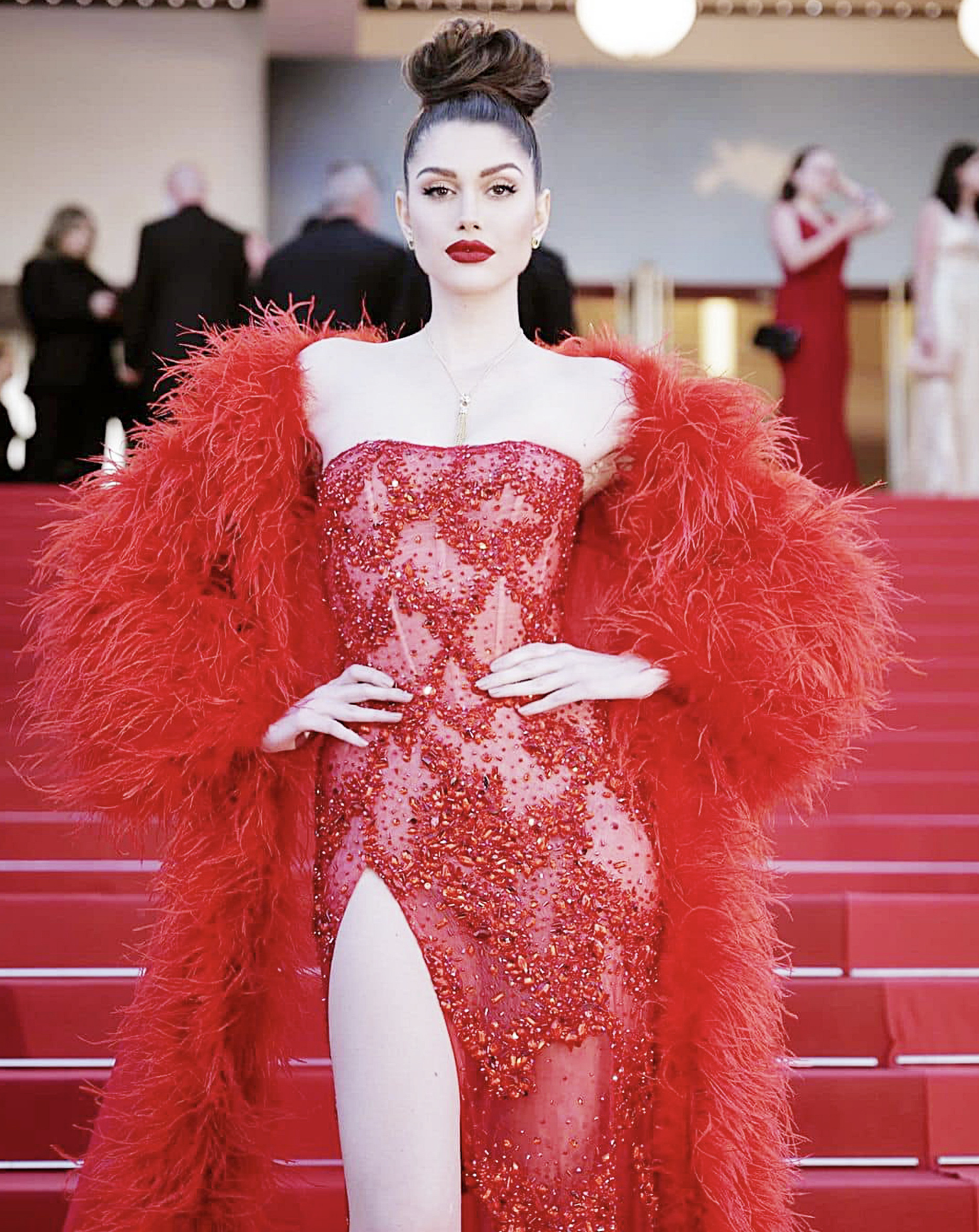 Isabella Menin, winner of the Miss Grand International 2022, donning an outfit by designer Le Thanh Hoa at a Cannes red carpet event.