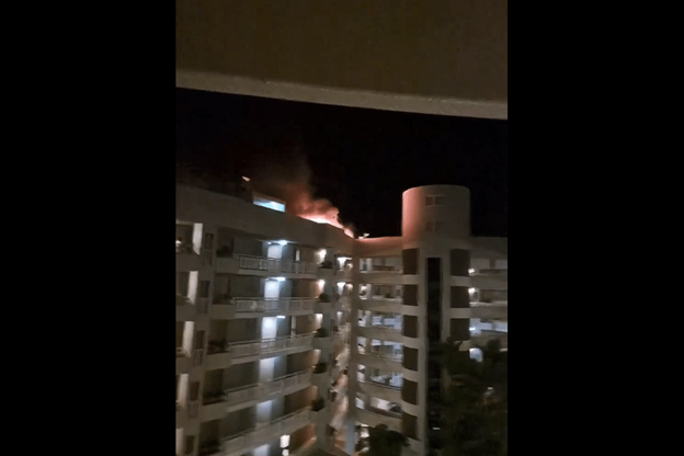 Helicopter crashes into roof of Cairns Hilton DoubleTree hotel, killing pilot