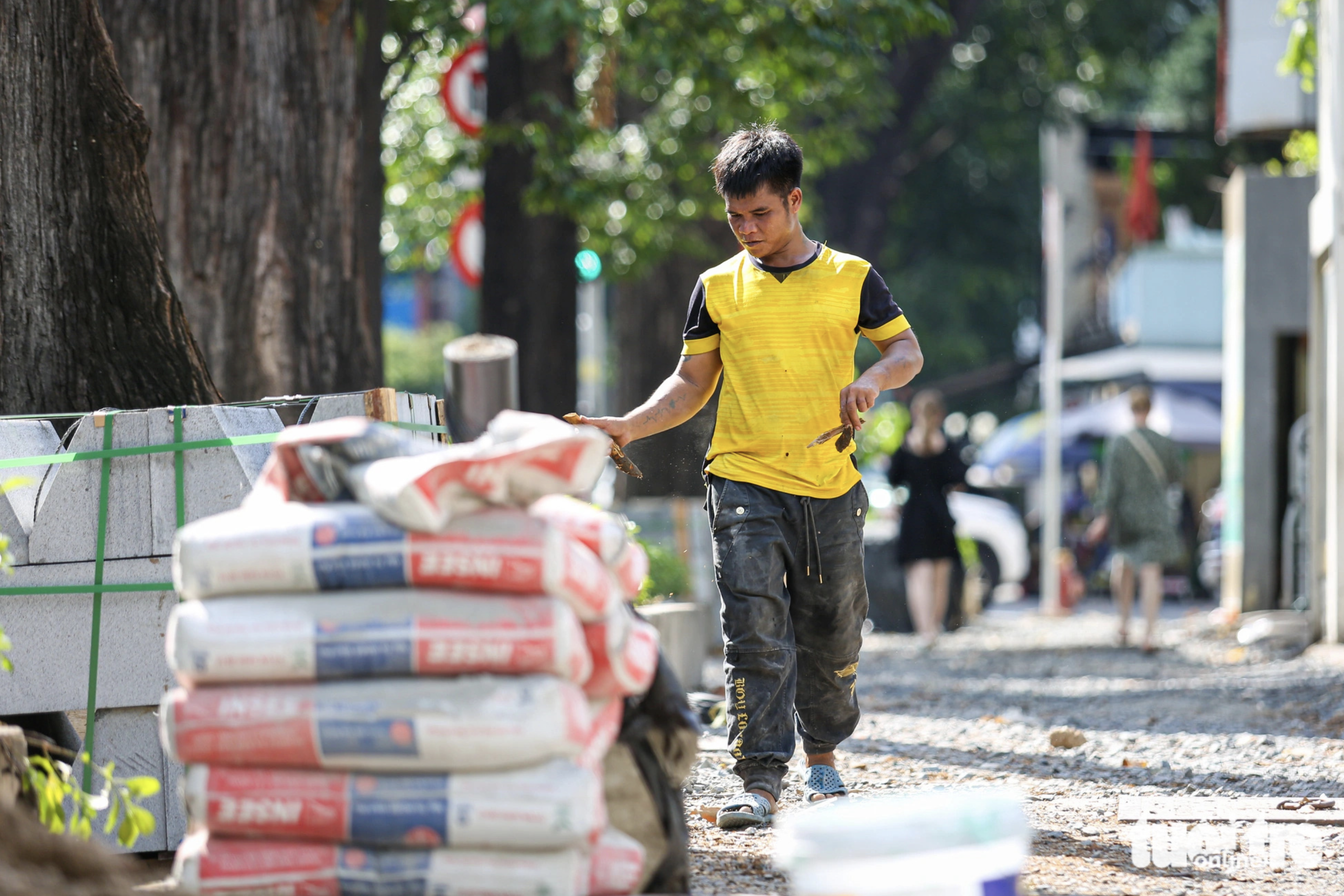 Building materials transported to a construction site to renovate pavements in downtown Ho Chi Minh City.