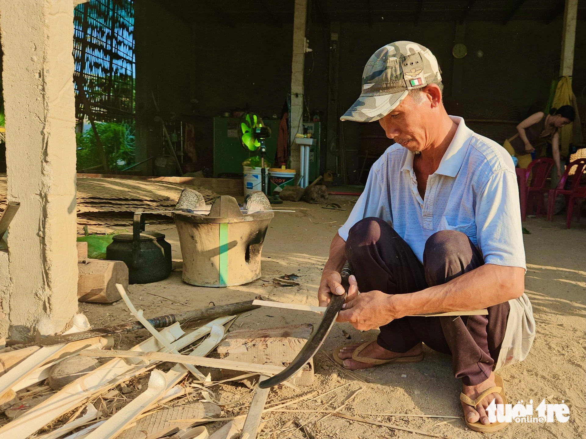 Truong Van Trung whittles bamboo tubes into strips at Phu My basket boat craft village in Tuy An District, Phu Yen Province, south-central Vietnam. Photo: Minh Chien / Tuoi Tre