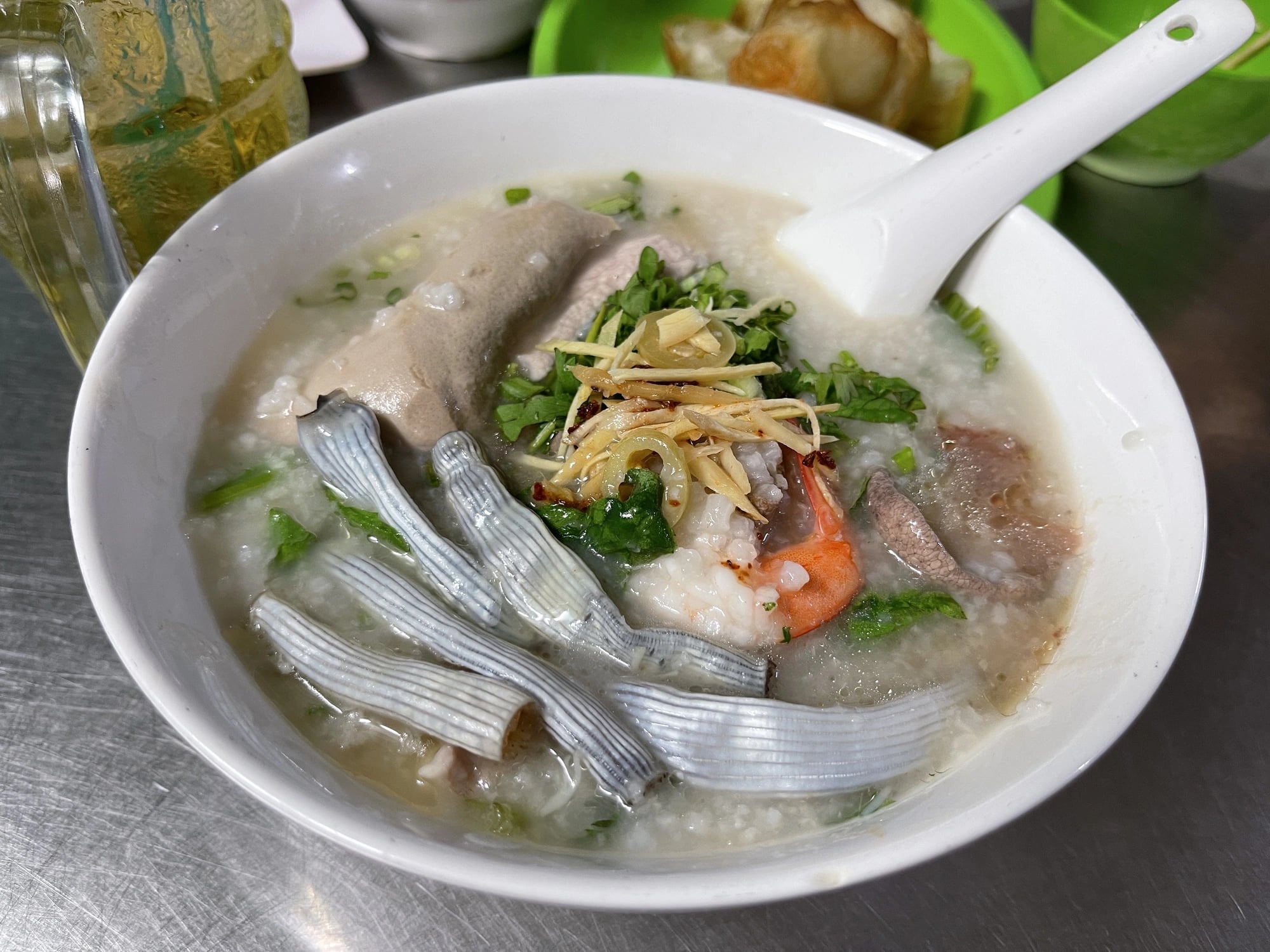 This hidden 40-year-old shop in Ho Chi Minh City serves porridge with peanut worms