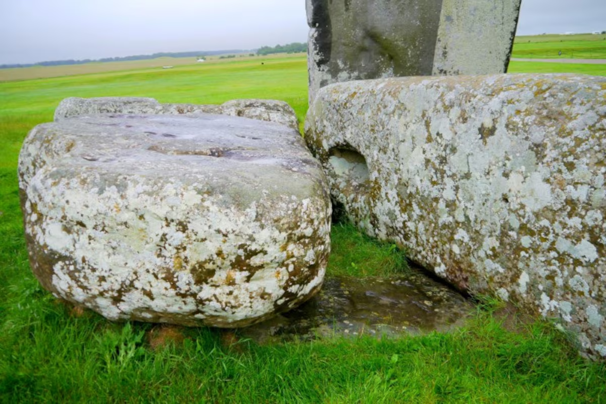 The Altar Stone at the ancient monument Stonehenge located on Salisbury Plain is seen underneath two bigger Sarsen stones in Wiltshire, Britain in this undated photo released on August 14, 2024. Professor Nick Pearce, Aberystwyth University/Handout via Reuters