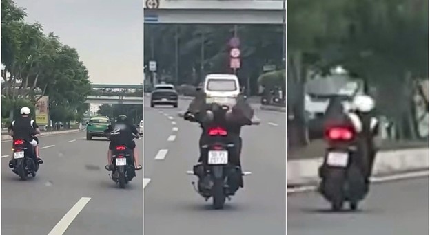 Video shows riders lying on motorbikes in car lane in Ho Chi Minh City