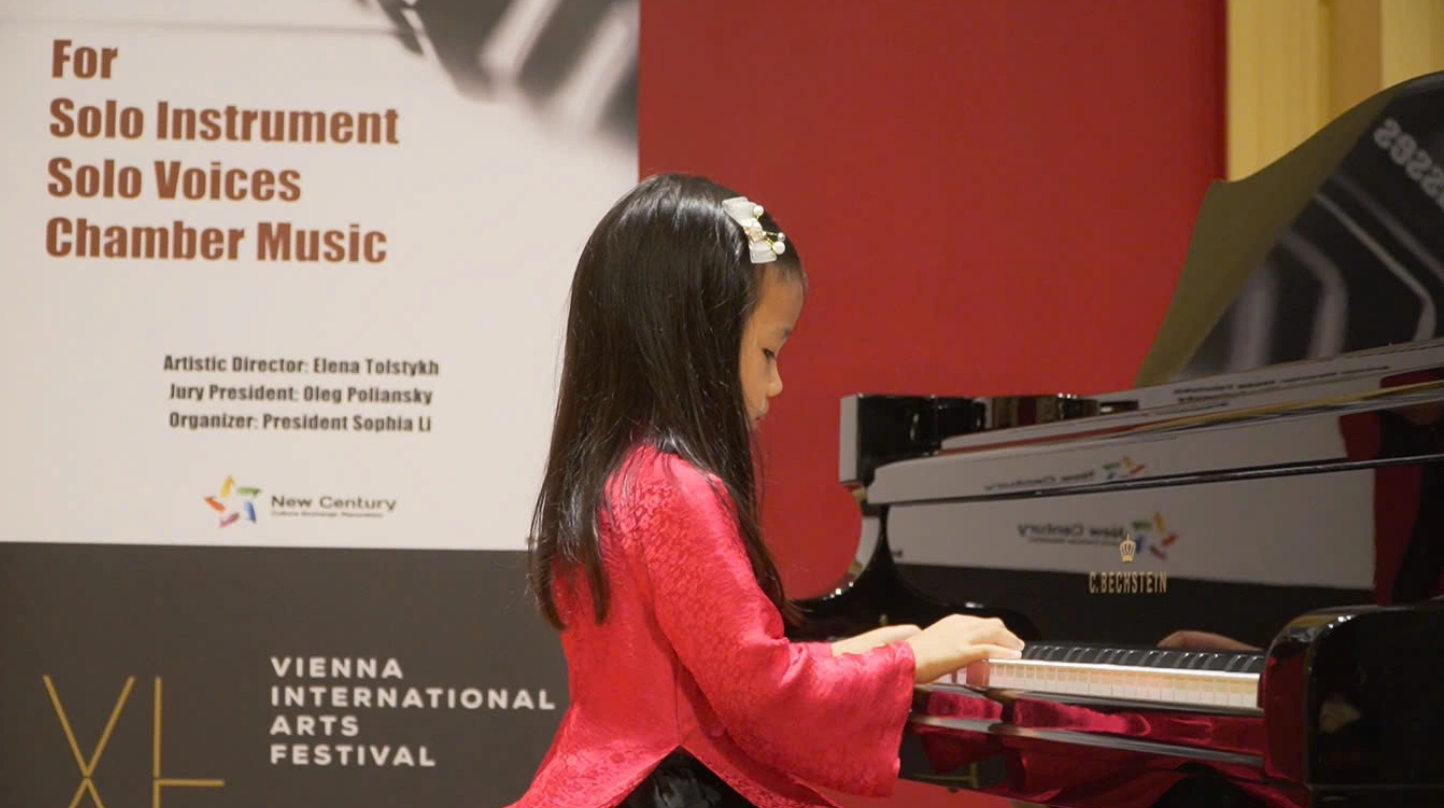 Vietnam’s contestant, Le Lam Anh, 5, plays piano at the Vienna International Arts Festival. Photo: Supplied