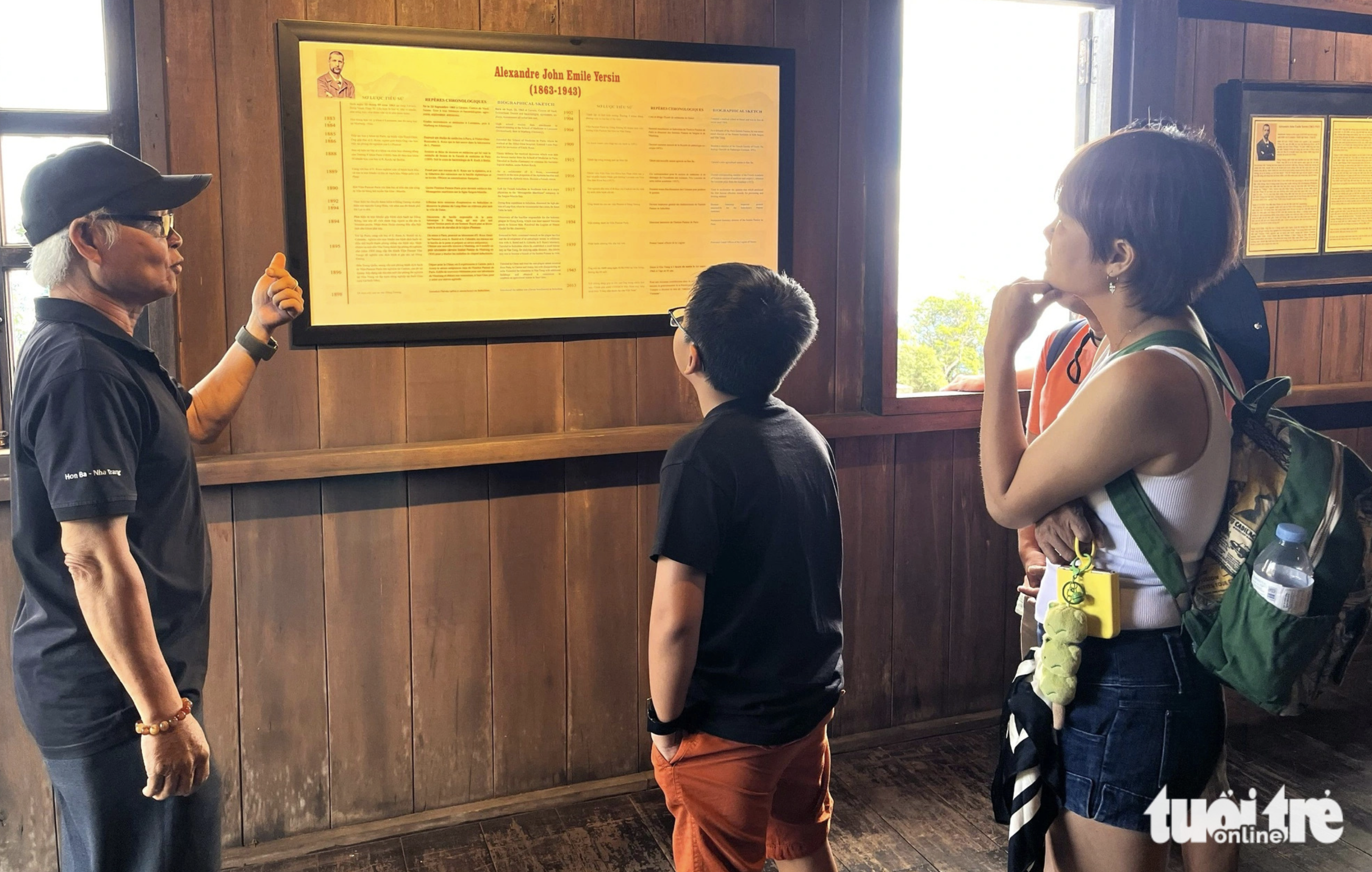 Tourists take a look at the biography of Dr. Alexandre Yersin at his house, located atop Hon Ba Mountain. Photo: Nguyen Hoang / Tuoi Tre