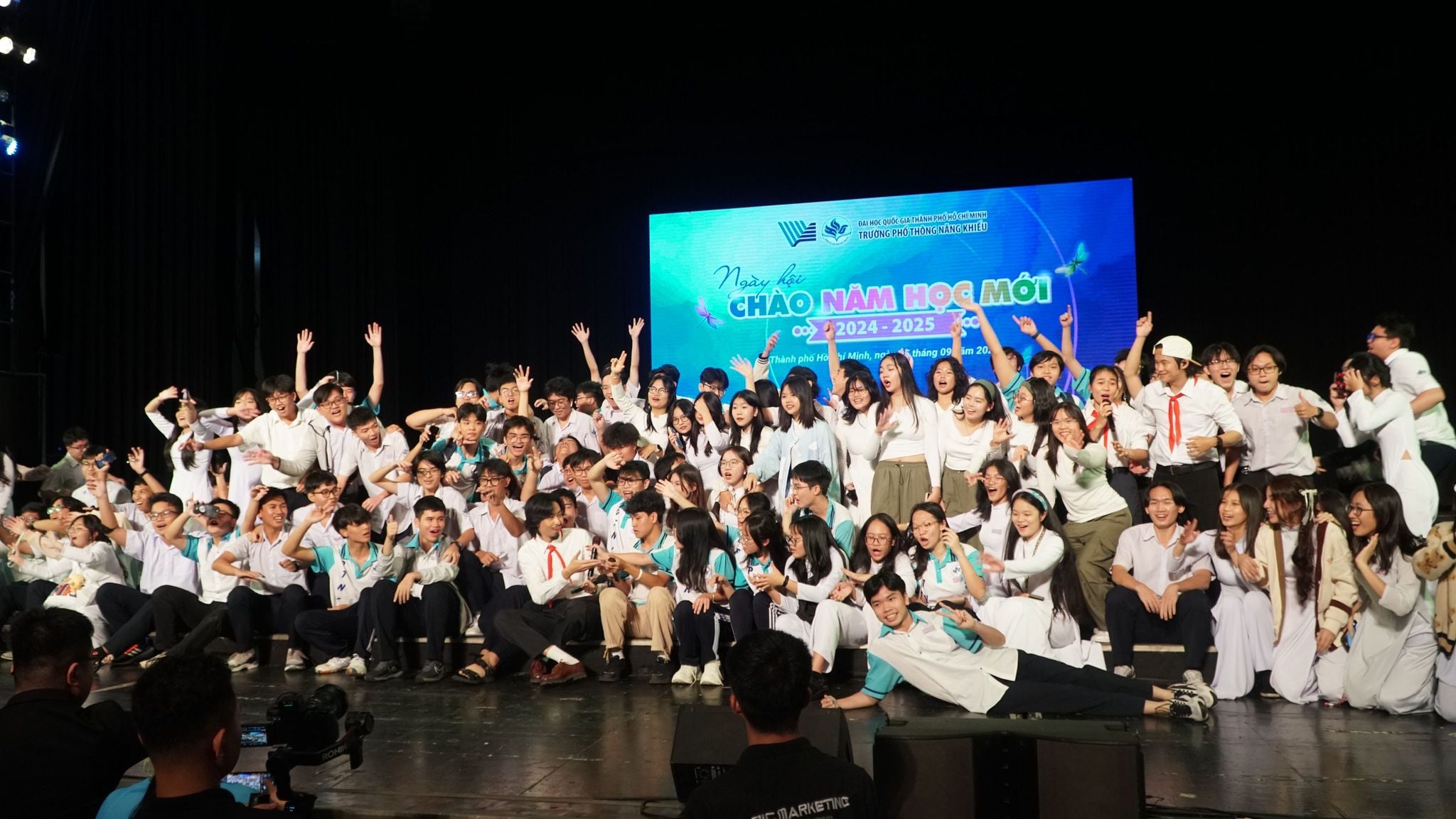 Popular Vietnamese rapper Den Vau poses with students at the new school year opening ceremony at the High School for Gifted Students under the Vietnam National University-Ho Chi Minh City, September 5, 2024.