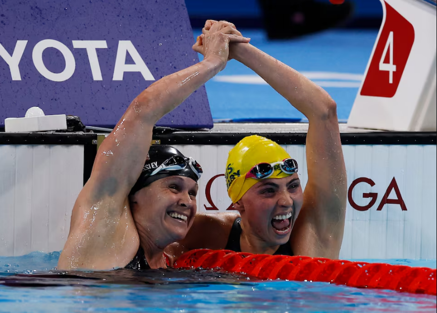 Paris 2024 Paralympics - Swimming - Women's 100m Freestyle - S9 Final - Paris La Defense Arena, Nanterre, France - September 4, 2024 Alexa Leary of Australia celebrates after winning gold with silver medallist Christie Raleigh-Crossley of United States. Photo: Reuters