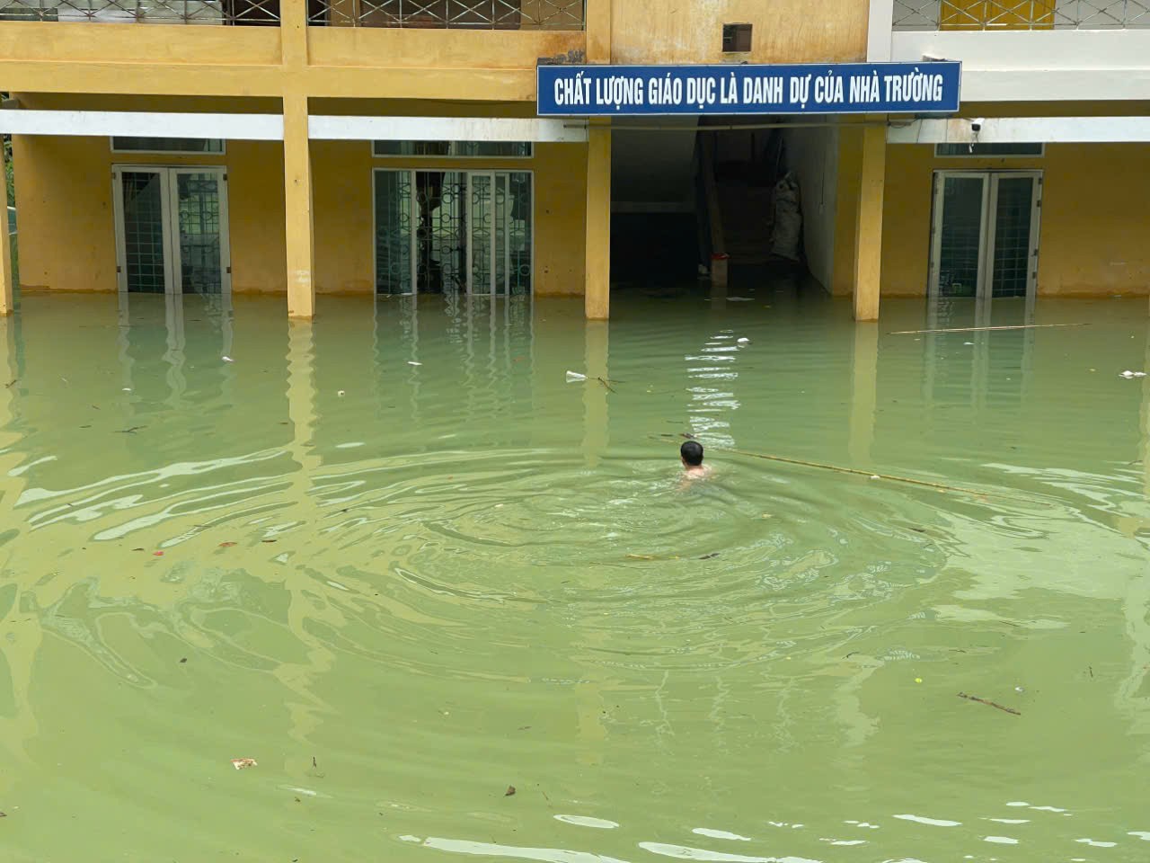 This principal swam into a flooded school to save whatever he could get his hands on