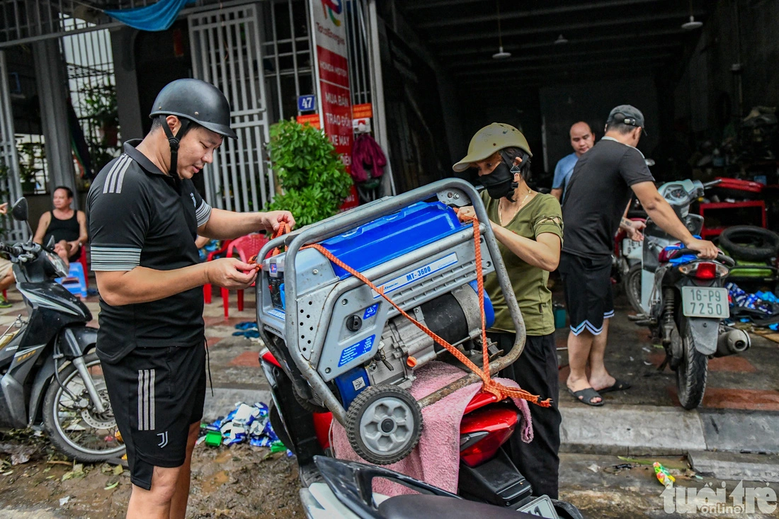 Residents buy electric generators as Cat Ba Town, Cat Hai District, Hai Phong City suffers a power outage following typhoon Yagi.