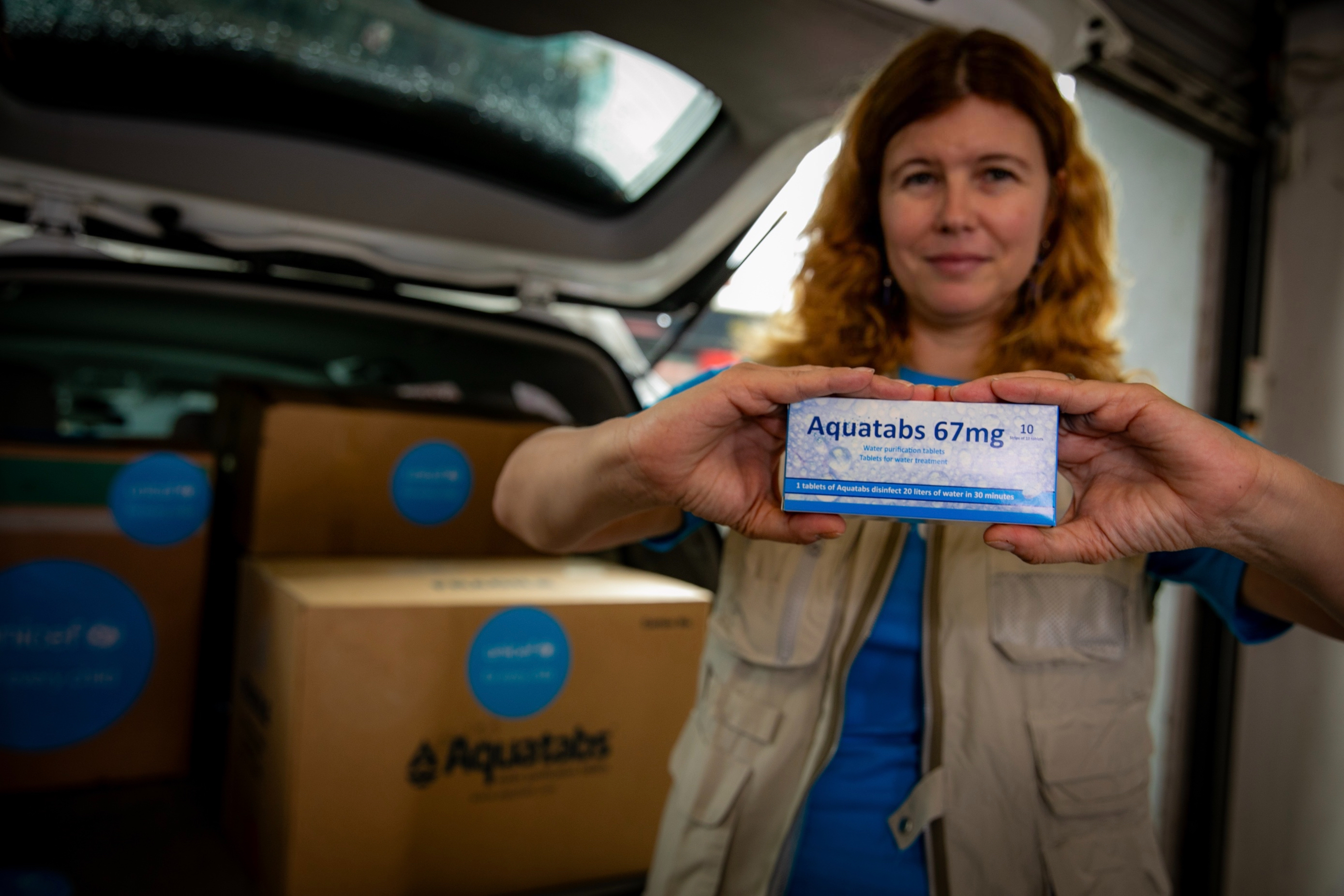 UNICEF Representative Silvia Danailov receiving water purification tablets provided by UNICEF to government partners for distribution to communities affected by typhoon Yagi in Vietnam. Photo: UNICEF Vietnam