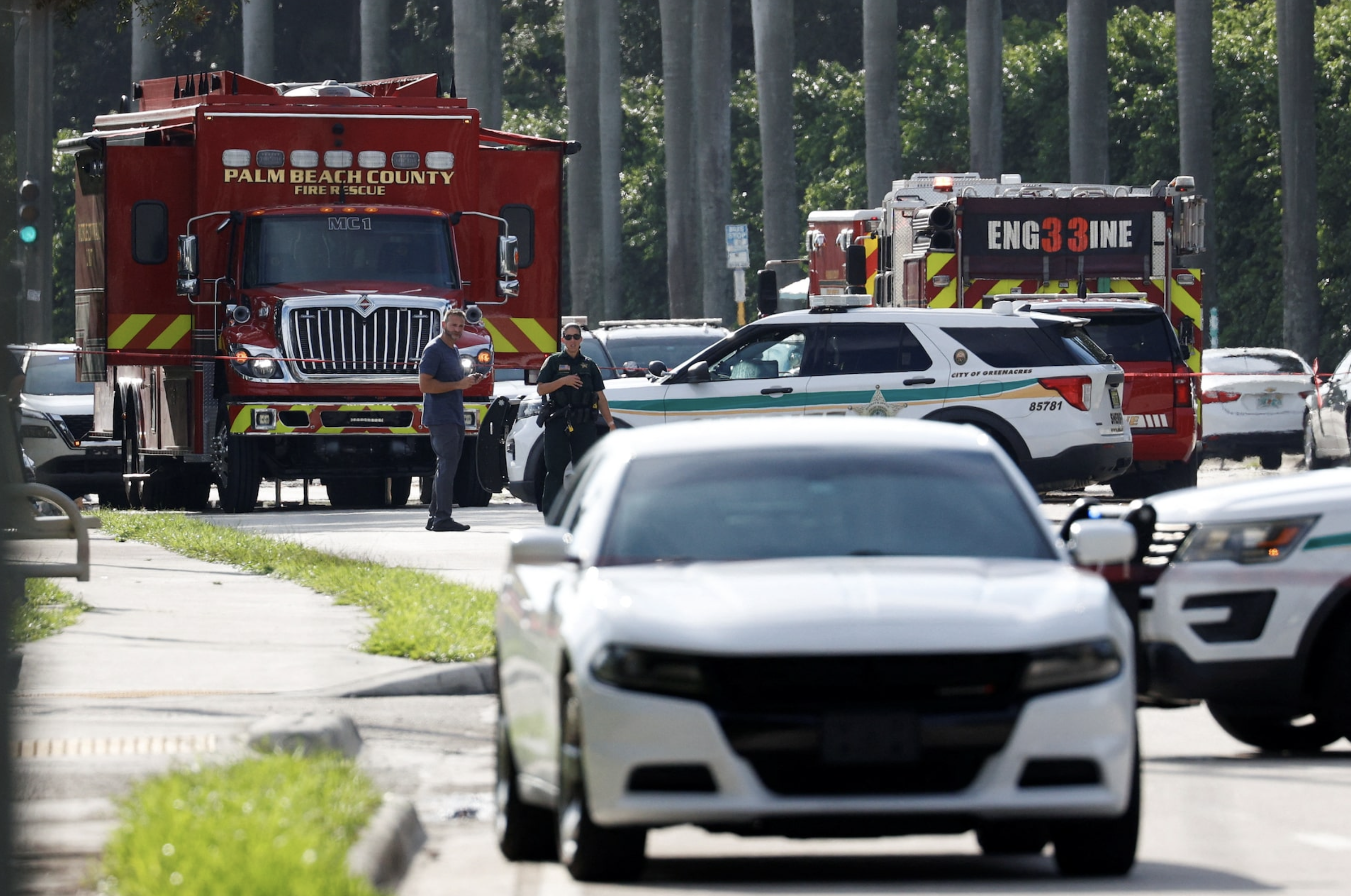 Law enforcement vehicles are parked after reports of shots fired outside Republican presidential nominee and former U.S. President Donald Trump's Trump International Golf Course in West Palm Beach, Florida, U.S. September 15, 2024. Photo: Reuters