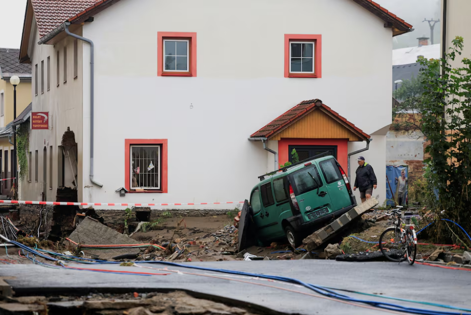 A man walks next to a damaged building, in the aftermath of flooding following heavy rainfalls, in Jesenik, Czech Republic, September 16. Photo: Reuters