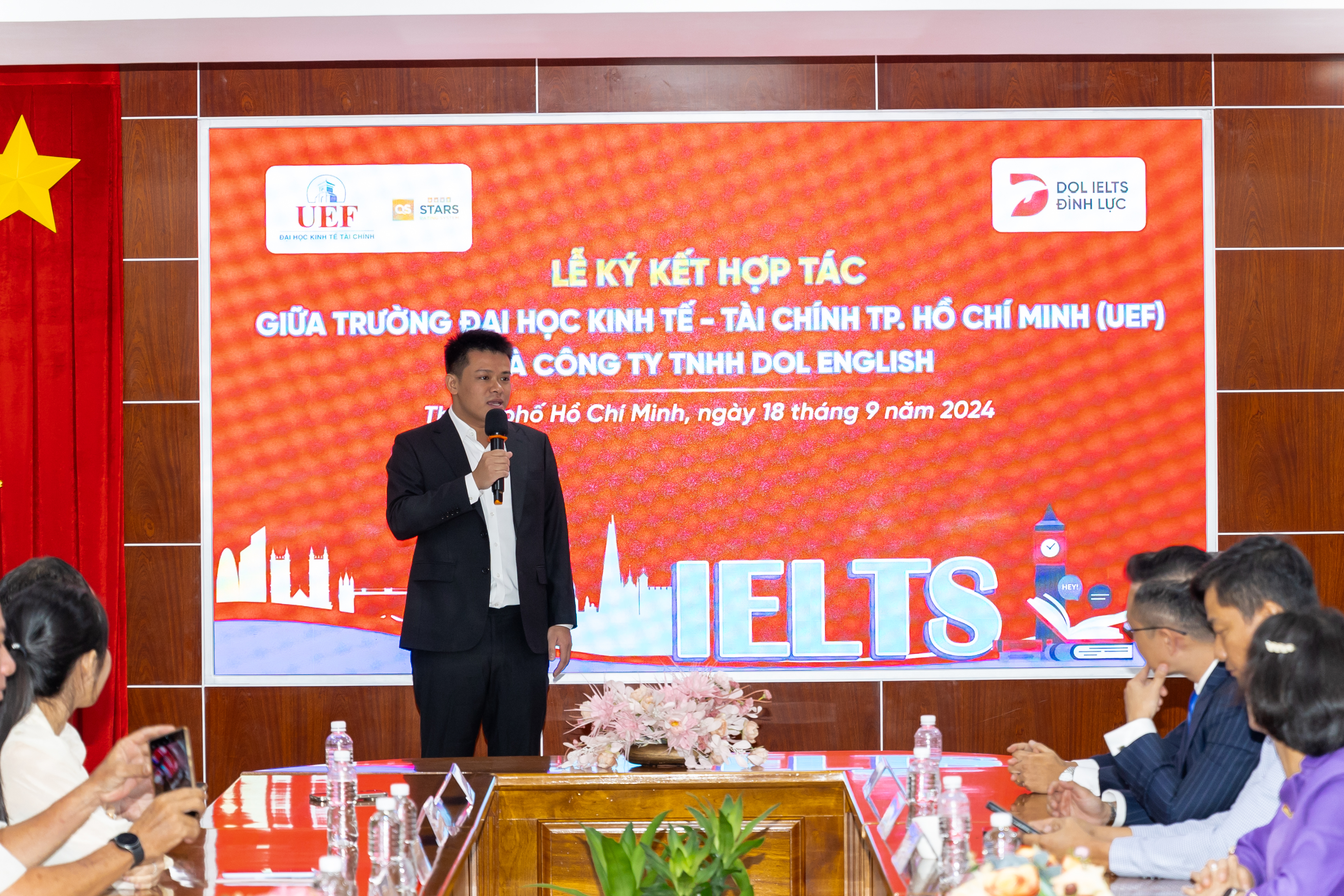 Le Dinh Luc, founder and CEO of DOL English, speaks at the ceremony to sign a partnership agreement between his company and the Ho Chi Minh City University of Economics and Finance in Ho Chi Minh City, September 18, 2024.