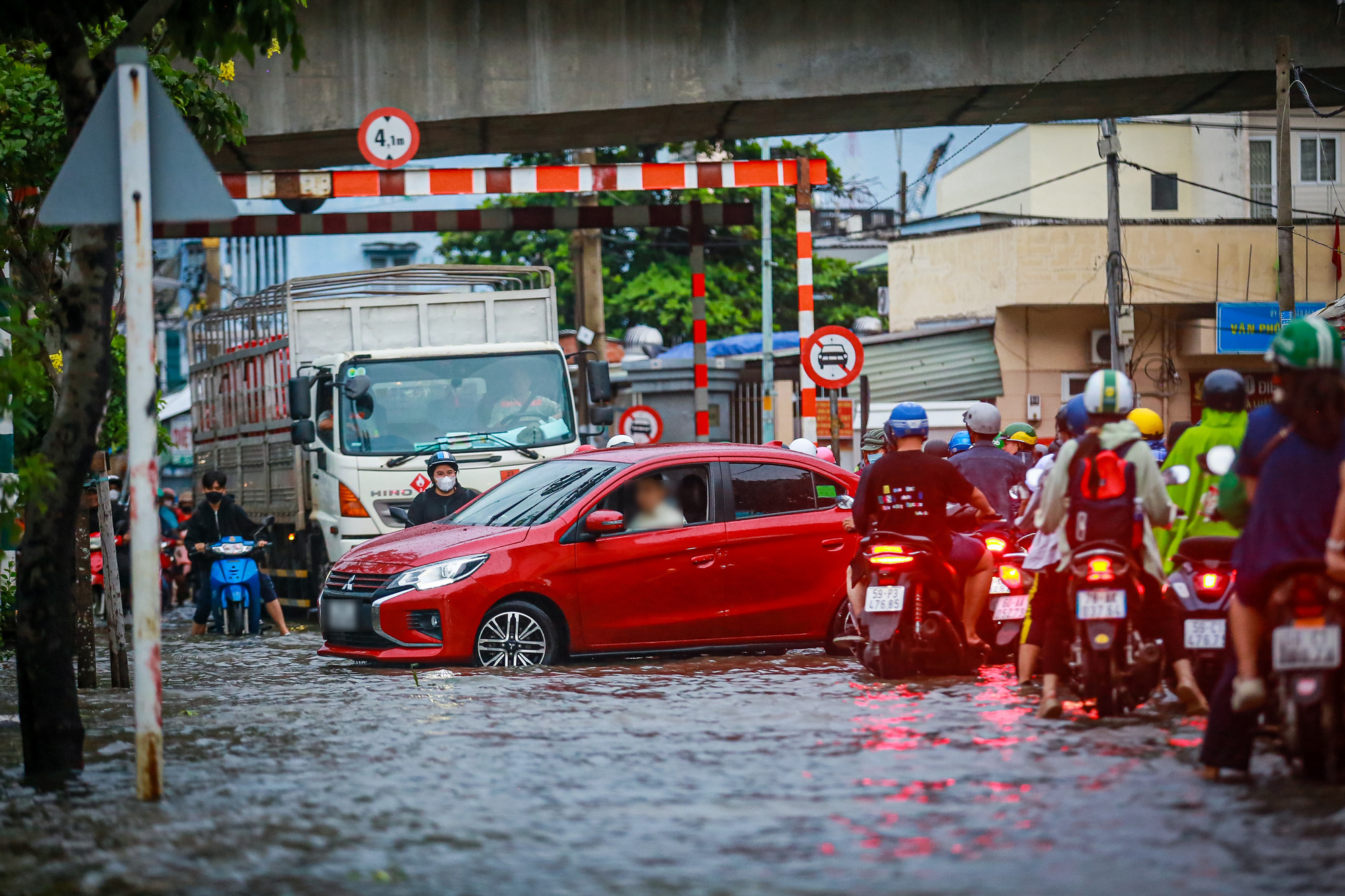 Flooding-prone street submerged as high tides, rain combine in Ho Chi Minh City