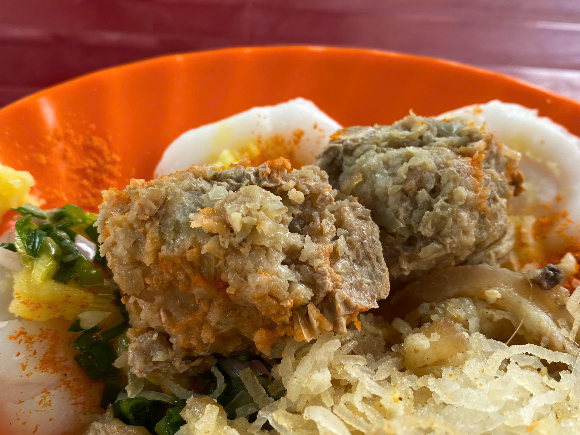 Meatballs are the highlight of the ‘bánh bèo’ dish at a makeshift shop in front of Long Binh Temple in Long Dien Town, Long Dien District, Ba Ria-Vung Tau Province, southern Vietnam. Photo: Dang Khuong / Tuoi Tre