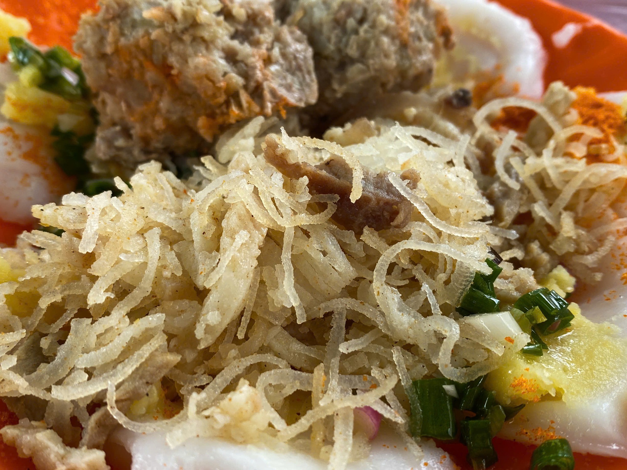 Shredded pork skin is a key ingredient of the ‘bánh bèo’ dish at a makeshift shop in front of Long Binh Temple in Long Dien Town, Long Dien District, Ba Ria-Vung Tau Province, southern Vietnam. Photo: Dang Khuong / Tuoi Tre